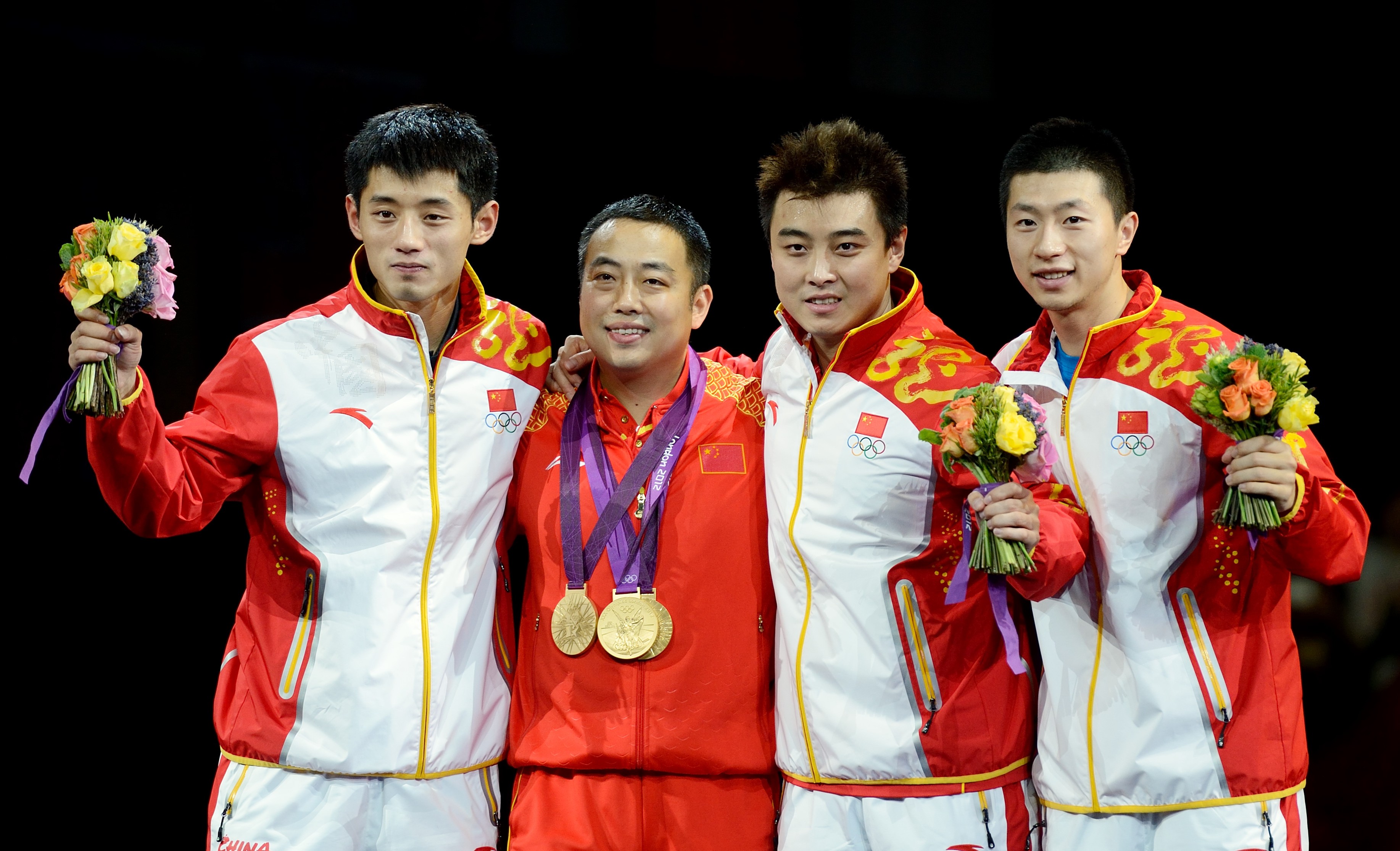 Table tennis stars Zhang Jike, coach Liu Guoliang, Wang Hao and Ma Long in 2012. Photo: Xinhua