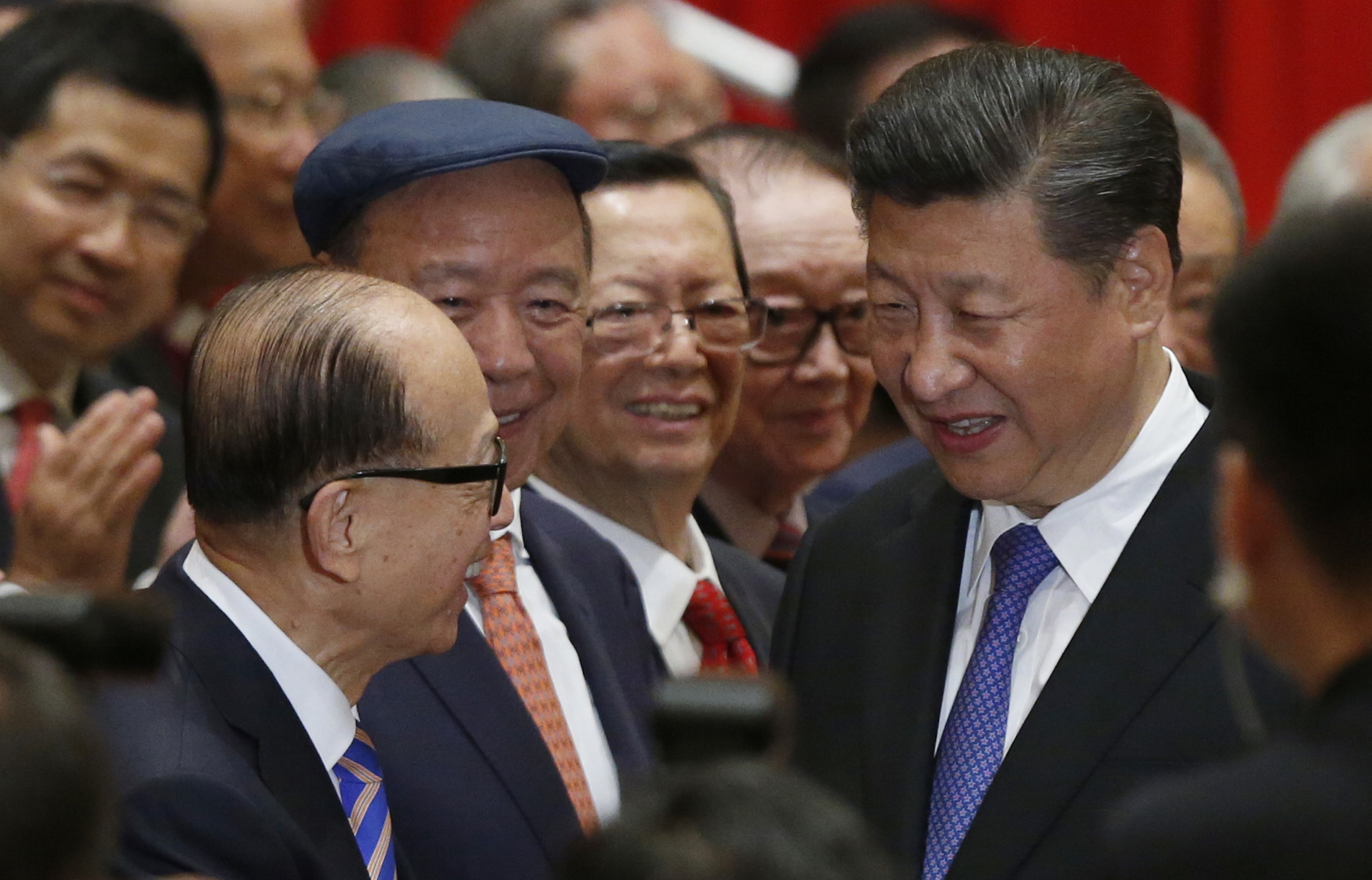 President Xi Jinping (right) is greeted by Li Ka-shing, Hong Kong’s richest man. Photo: AP