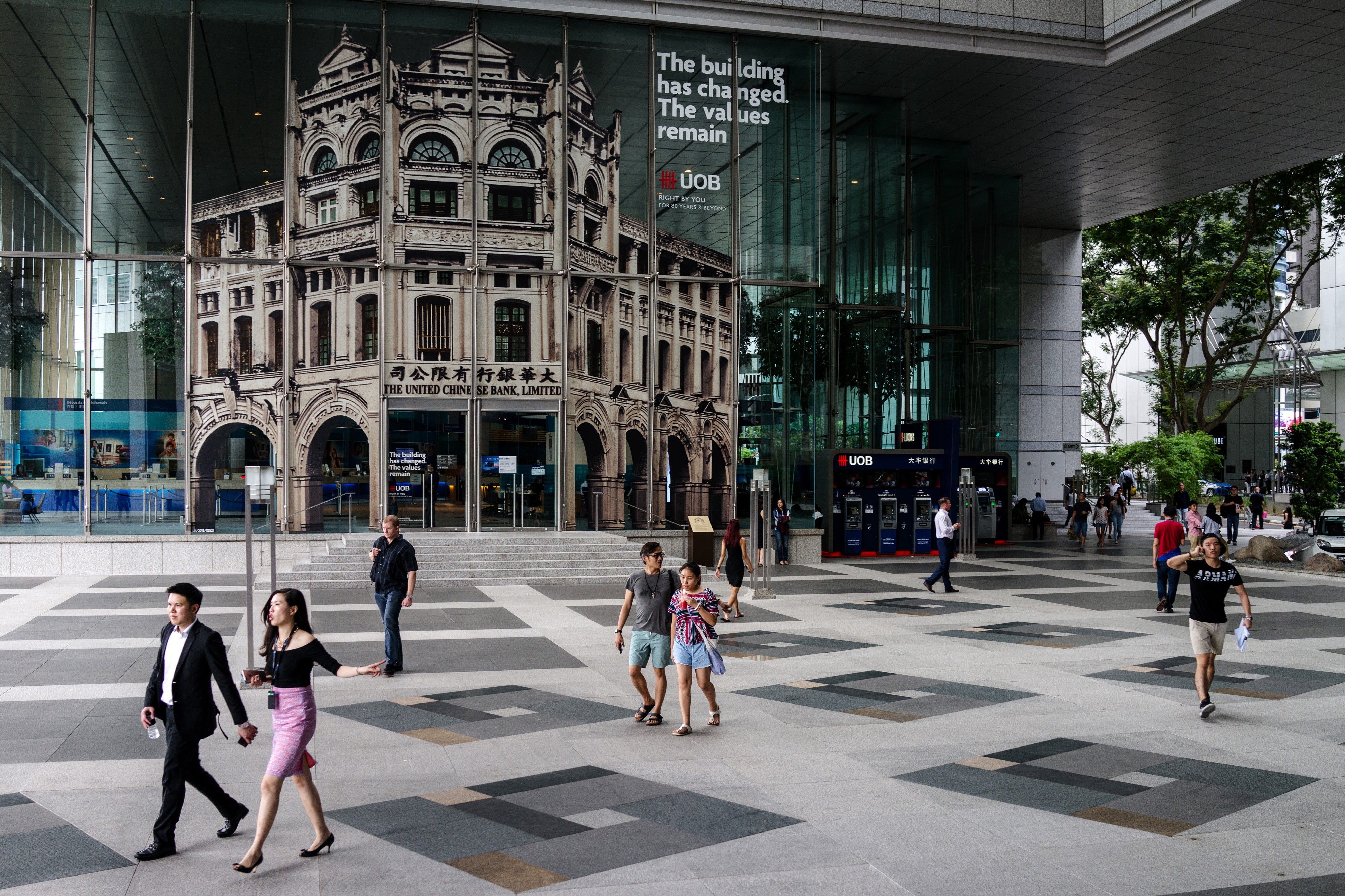 People walk in the central business district of Singapore. As recently as 1997, Hong Kong’s gross domestic product was above that of Singapore’s. But now, Singapore’s GDP per capita is US$51,855, compared with Hong Kong’s US$36,173, according to the World Bank. Photo: Bloomberg