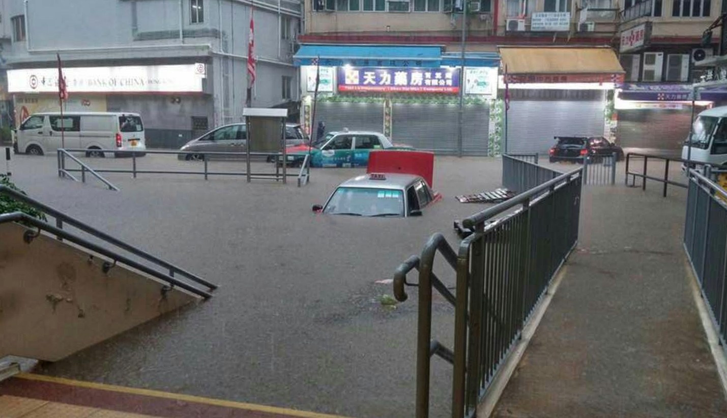 Vehicles seen partially submerged during rainstorms in Hong Kong in May, 2017. The gross value of insurance policy premiums in 2016 stood at HK$448.8 billion (US$57.55 billion), up 763 per cent from HK$52 billion in 1997, according to official figures. Photo: SCMP Handout