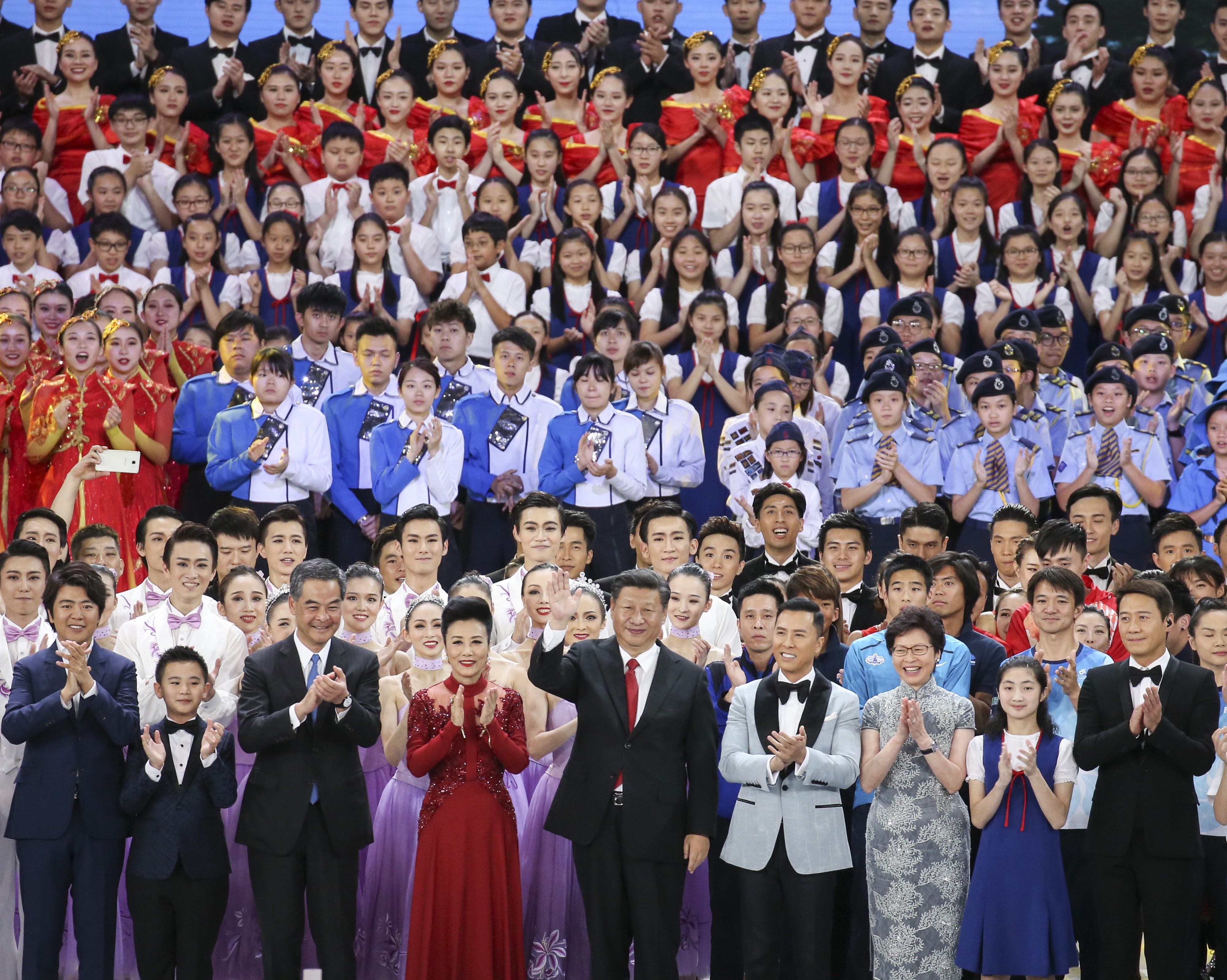 Chinese President Xi Jinping (centre) is all smiles on stage with Hong Kong Chief Executive Leung Chun-ying and his successor Carrie Lam, flanked by celebrities from the city and mainland. Photo: Dickson lee