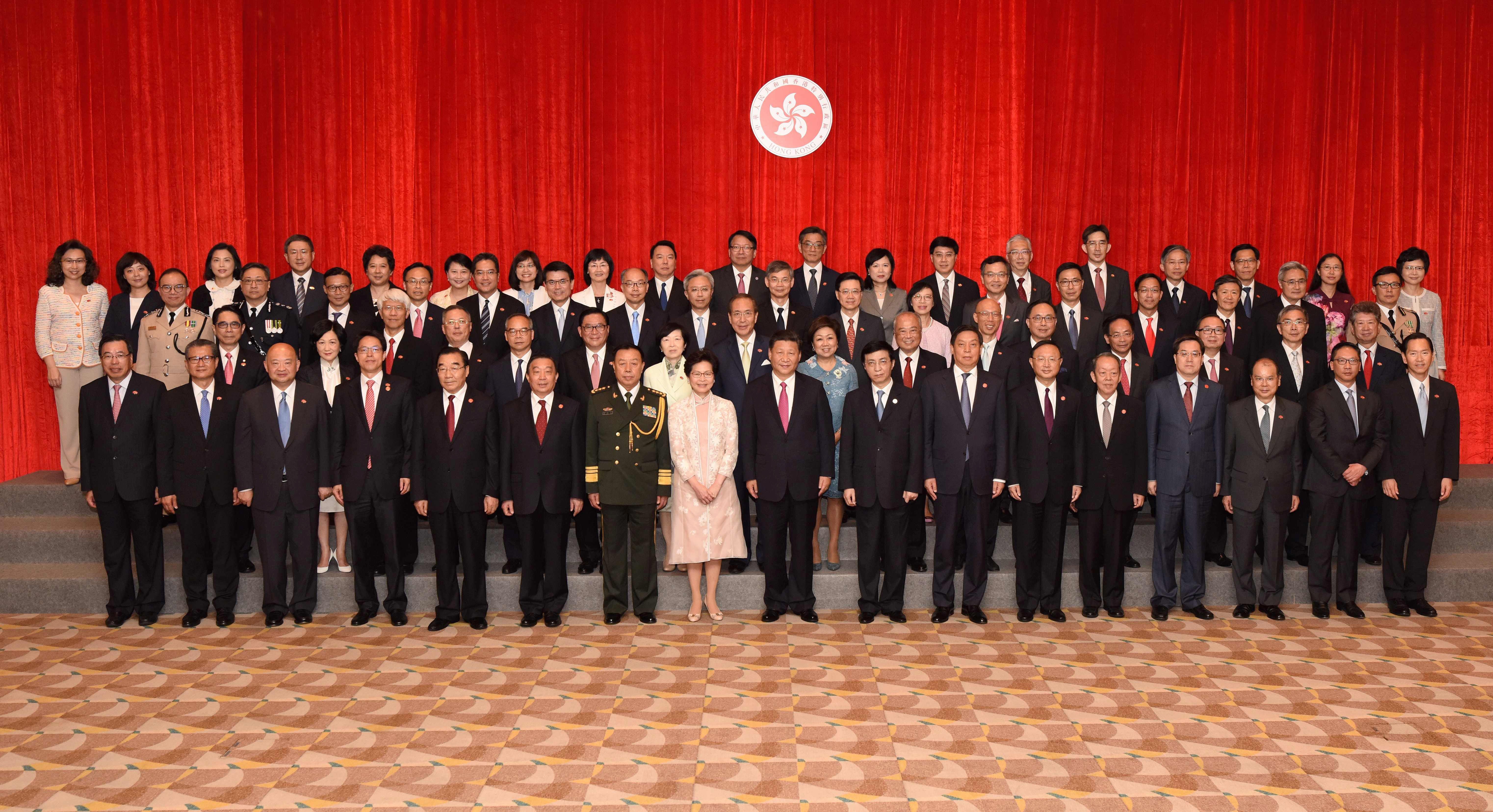 Carrie Lam poses with cabinet and Executive Council members and other dignitaries including President Xi Jinping. Photo: AFP