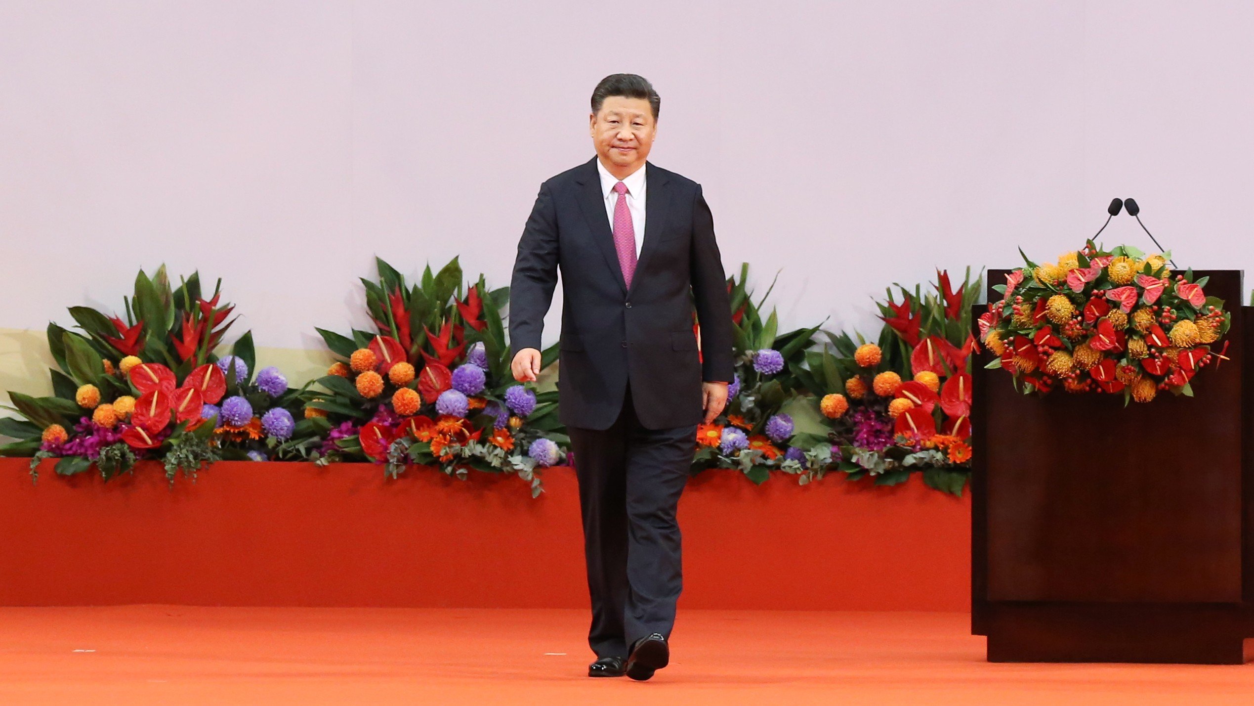 In the latter part of his speech, President Xi Jinping adopted a softer stance by calling on the public to solve problems through sensible communication instead of political confrontation. Photo: Sam Tsang