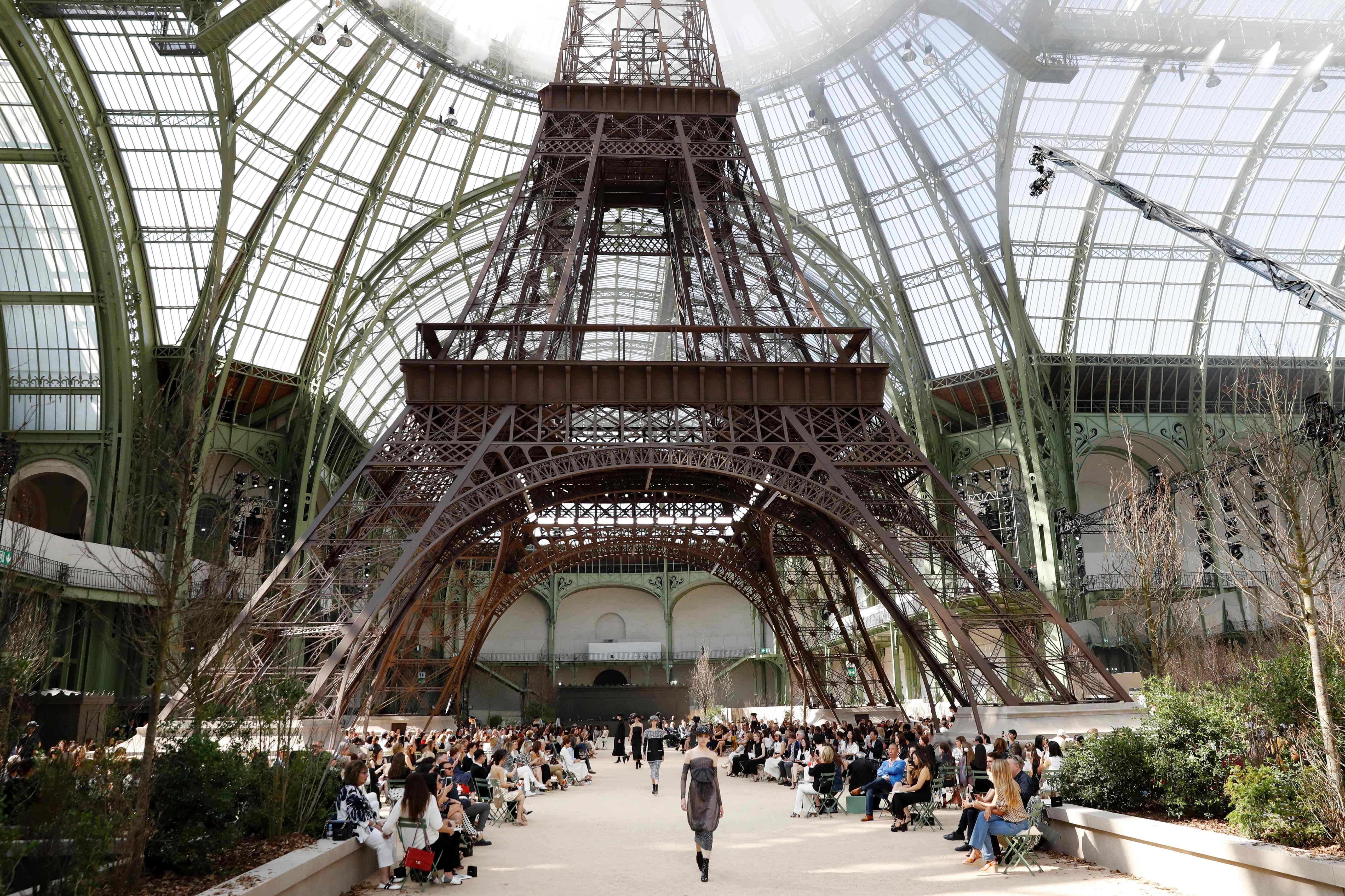 Models present creations for Chanel under a replica of the Eiffel Tower at the Grand Palais during the 2017-2018 fall/winter Haute Couture collection. Photo: AFP