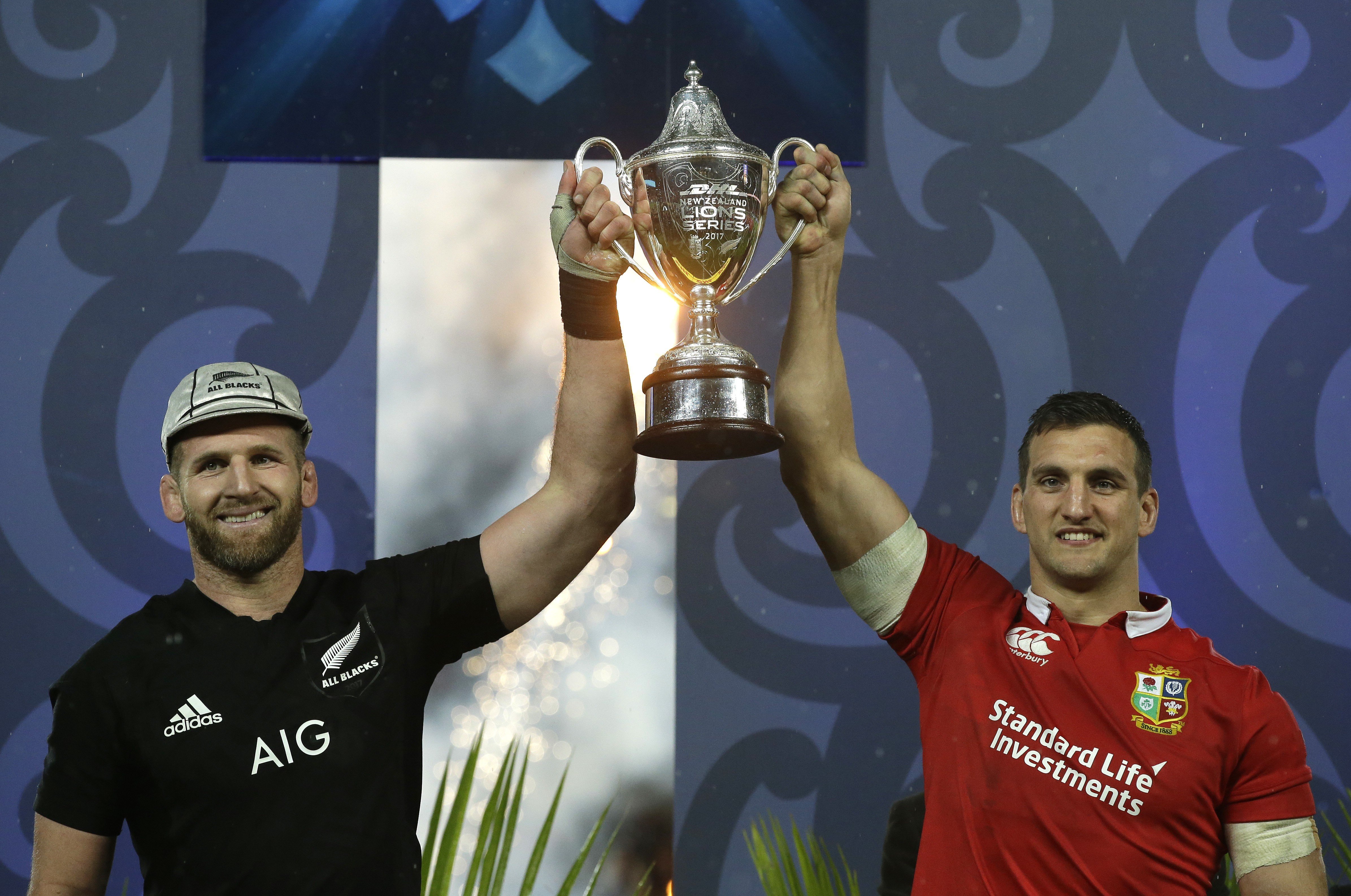 New Zealand captain Kieran Read (left) and Lions captain Sam Warburton hold the trophy after the third test at Eden Park ends in a draw. Photo: AP