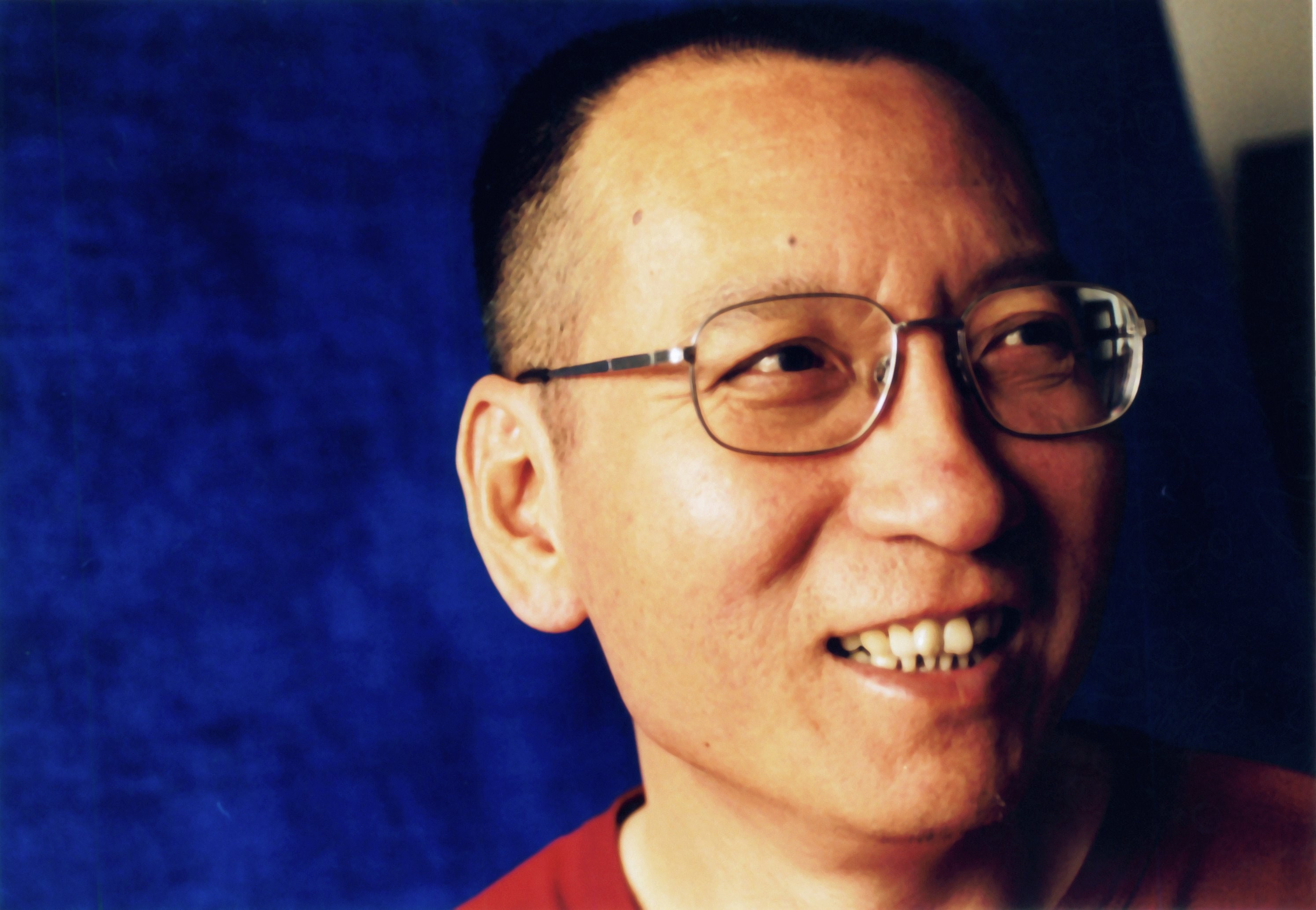 “RIP” and candle emojis were among the Liu Xiaobo tributes censored online in China. Photo: EPA