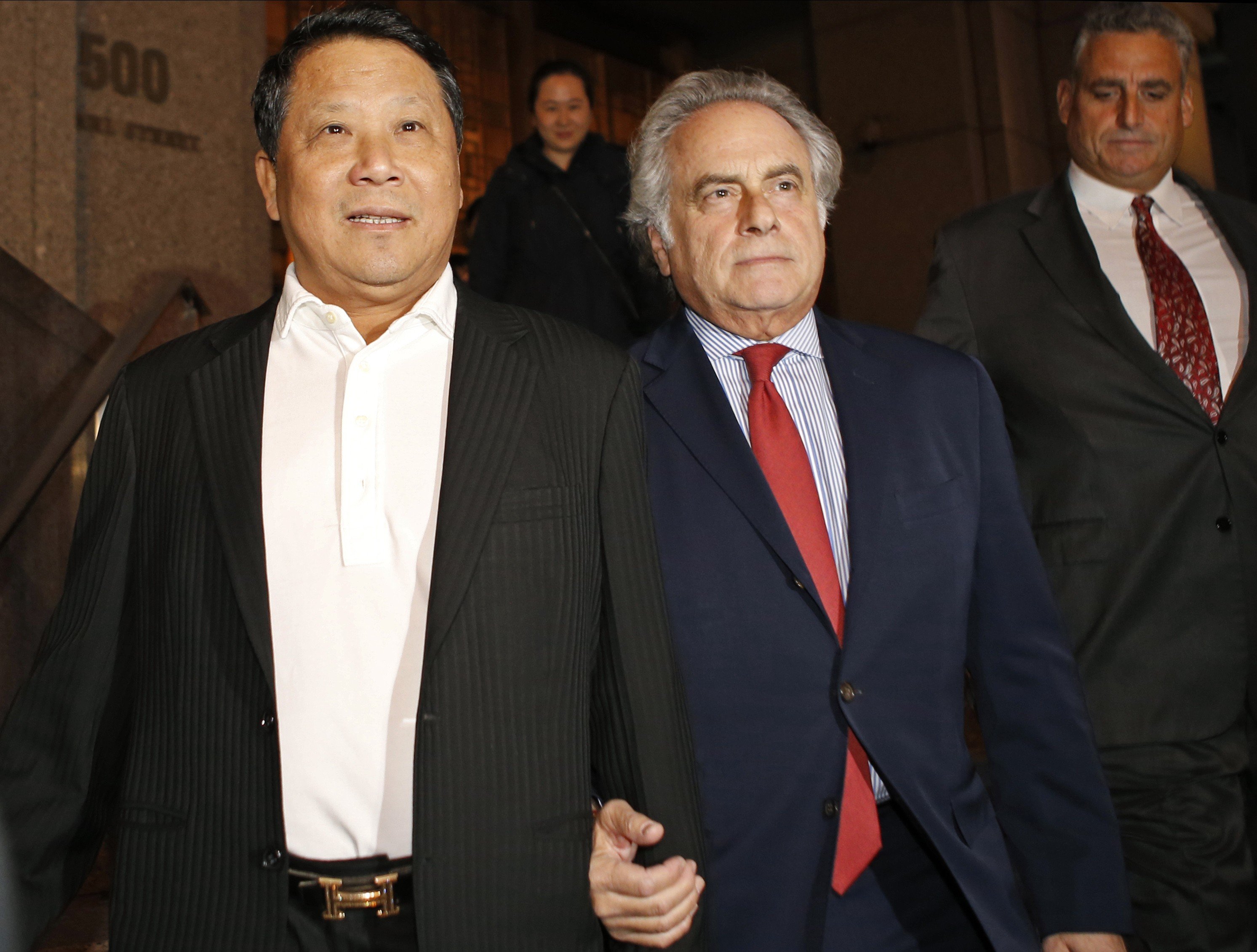 In this October 26, 2015, file photo, Macau billionaire Ng Lap-seng, left, leaves federal court with his attorney Ben Brafman after he was released on bail in connection with an alleged UN bribery scheme in New York. Photo: AP