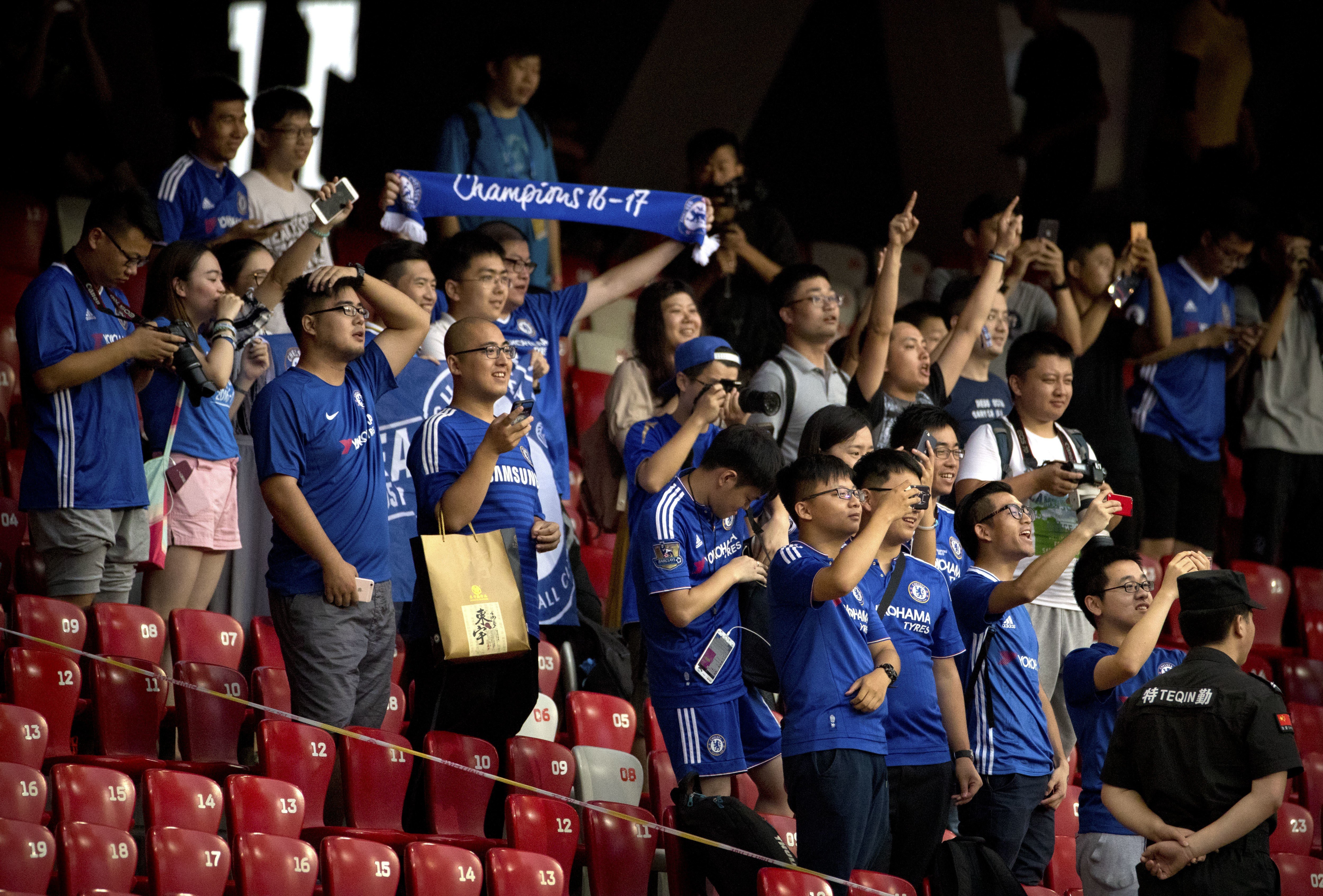 Chinese fans of Chelsea cheer during the team's practice session at the National Stadium. Photo: AP