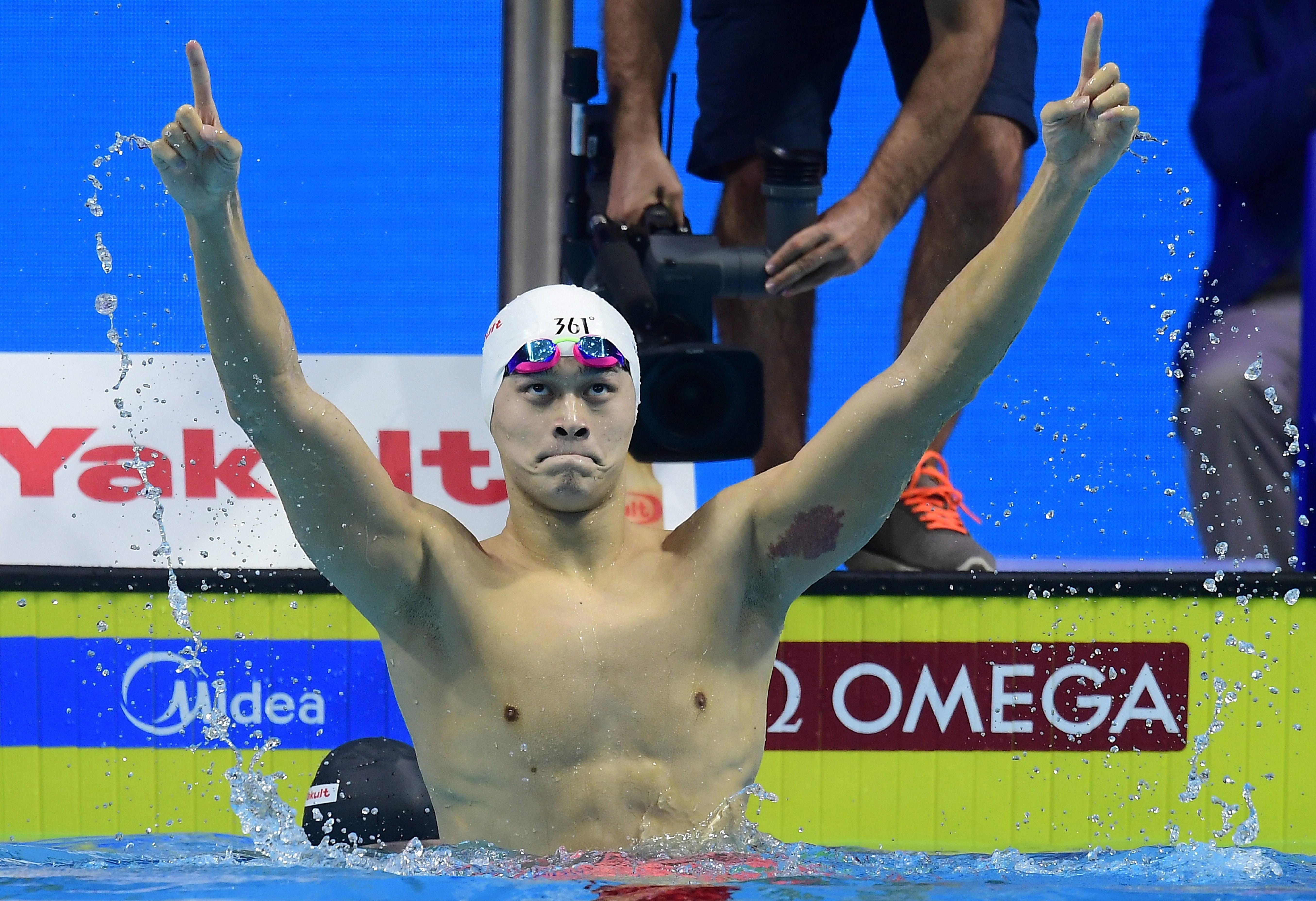 Sun Yang celebrates his victory in the men’s 200m freestyle of the 2017 world championships in Budapest. Photo: EPA