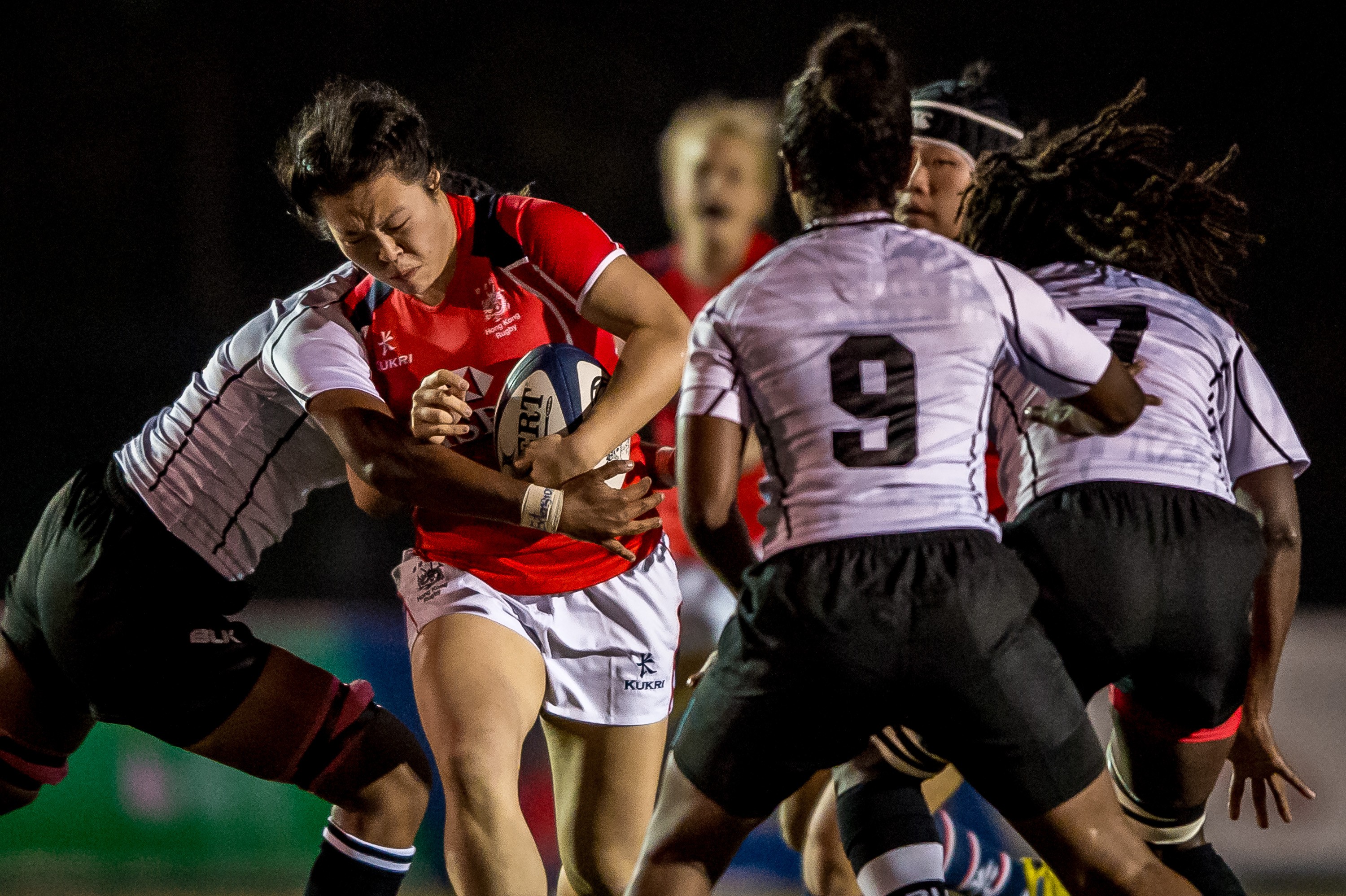 Karen So surges forward for Hong Kong against Fiji in the Women’s Rugby World Cup qualifiers. Photos: HKRU
