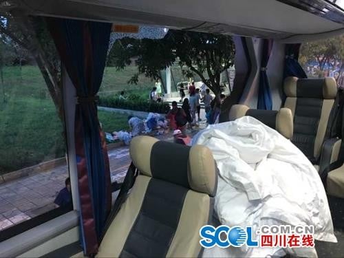 Several large rocks hit the tour bus the couple was travelling on, smashing the window beside them. Photo: Handout
