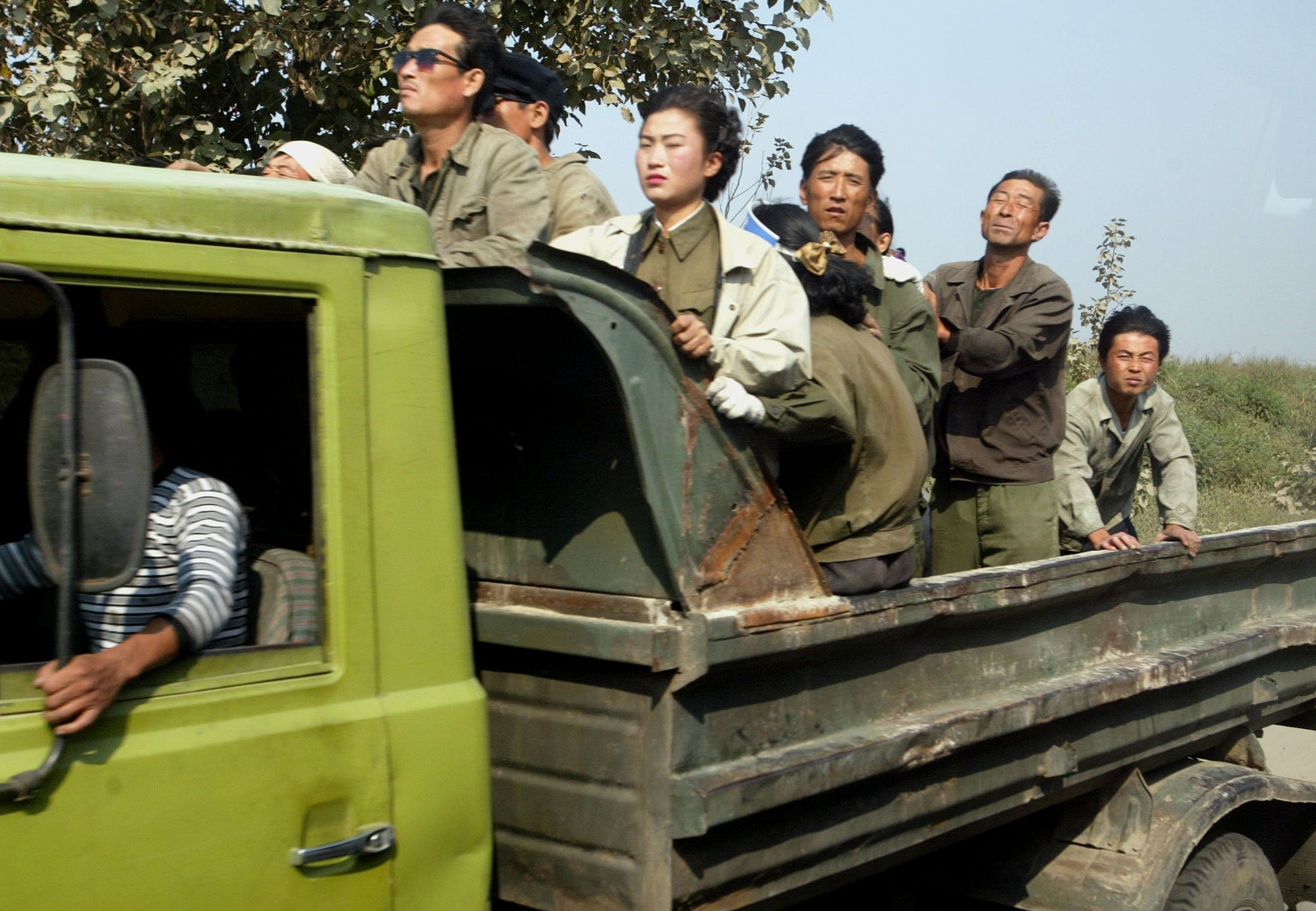 A group of North Korean farm labourers and soldiers in a truck driving along a country road in the northwestern part of the country. Photo: SCMP Pictures