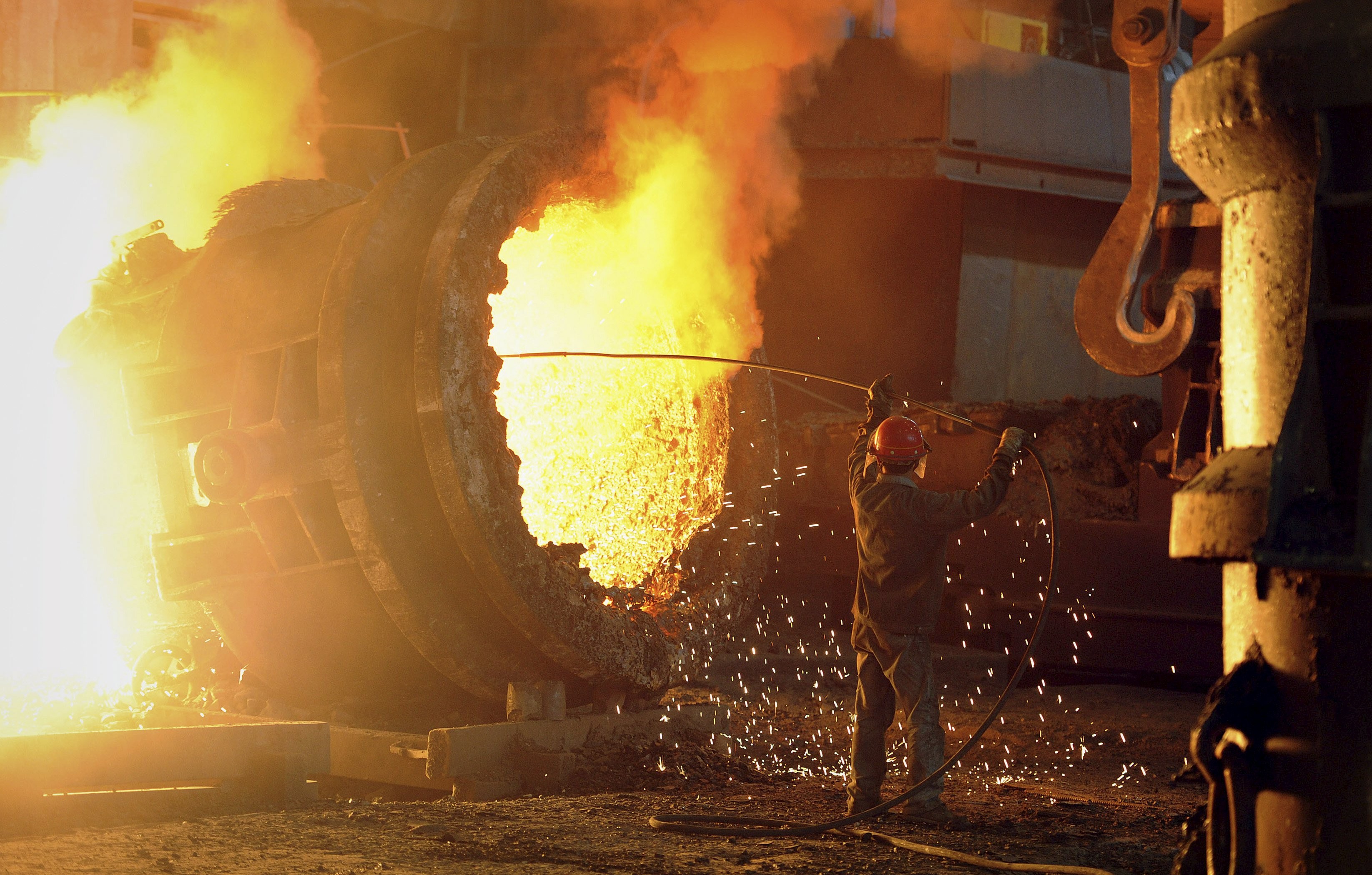 A steel worker operates a furnace at a steel manufacturing plant in Hefei. Photo: Reuters