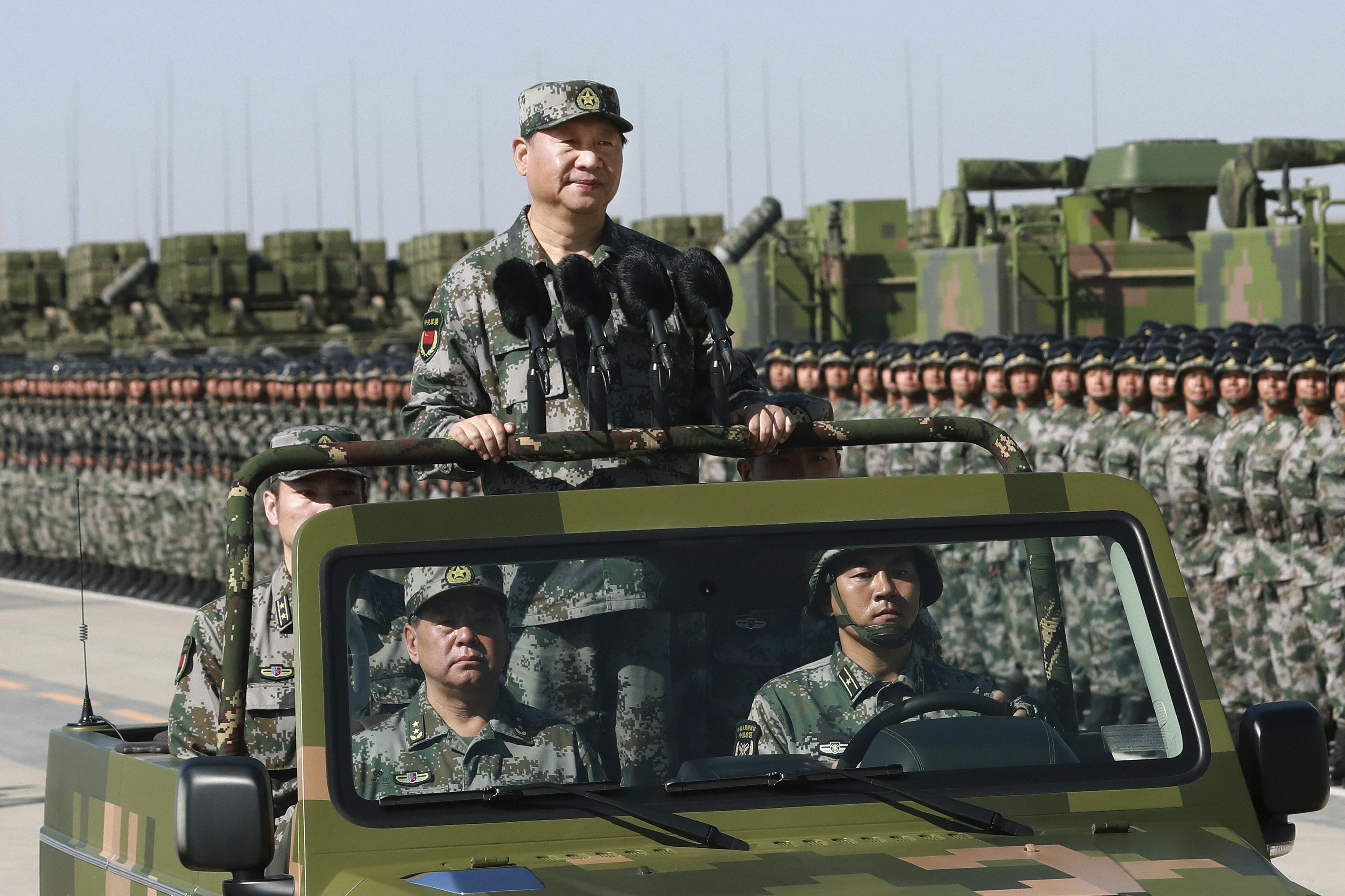 President Xi Jinping inspects troops during a military parade to commemorate the 90th anniversary of the founding of the PLA, at a training base in Inner Mongolia on July 30. Photo: Xinhua