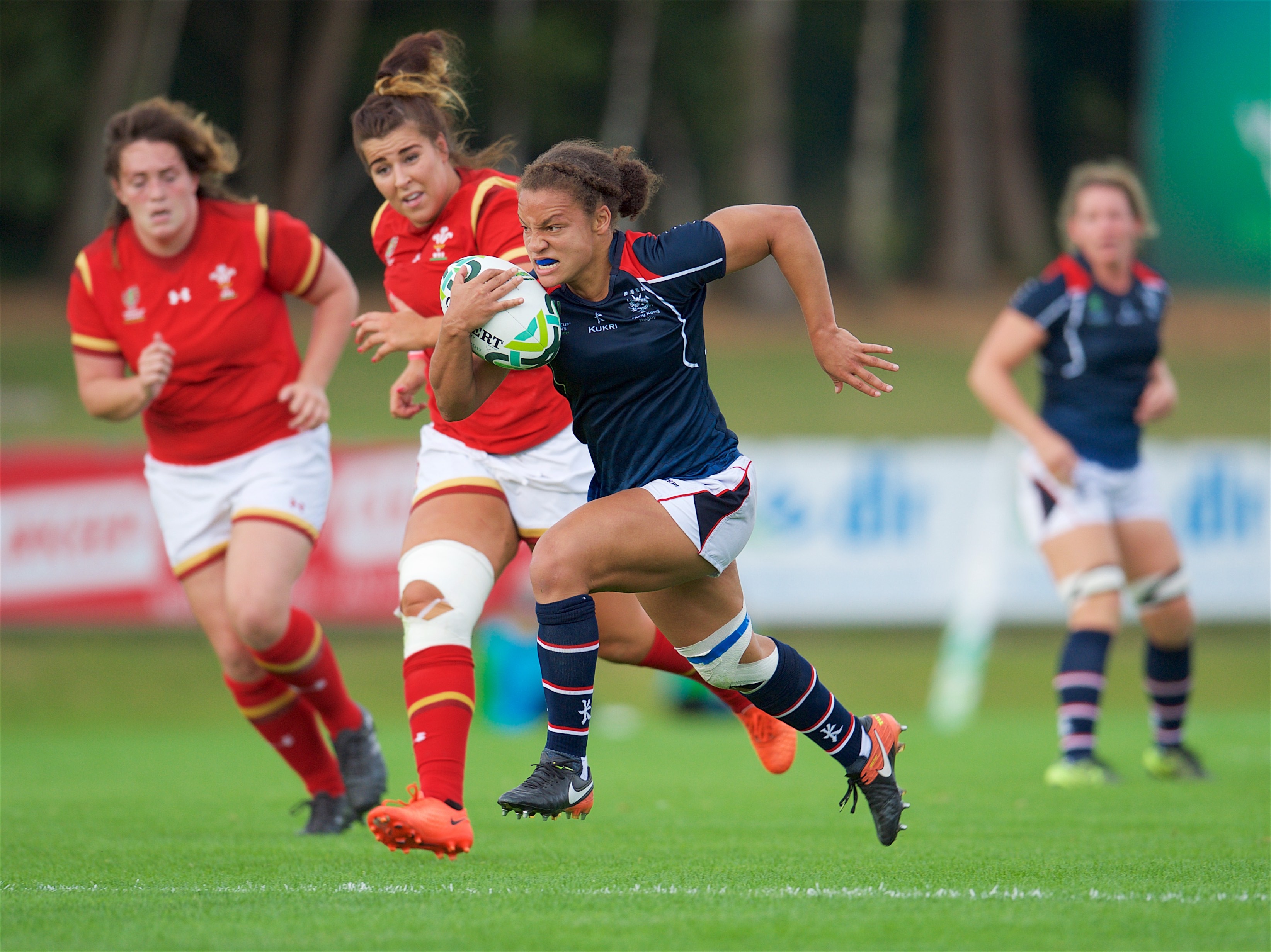 Natasha Olson-Thorne charges away to score for Hong Kong against Wales. Photo: HKRU
