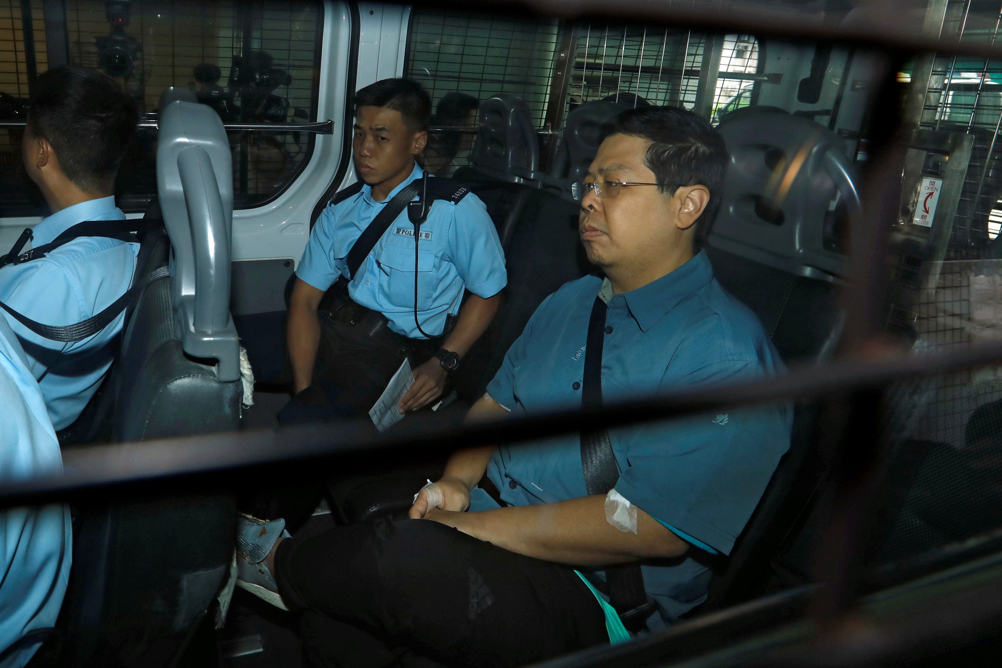 Howard Lam is brought to Kowloon City Magistrates’ Courts on August 17. Lam has been charged with misleading police over claims he was assaulted and illegally detained by mainland agents. Photo: Reuters
