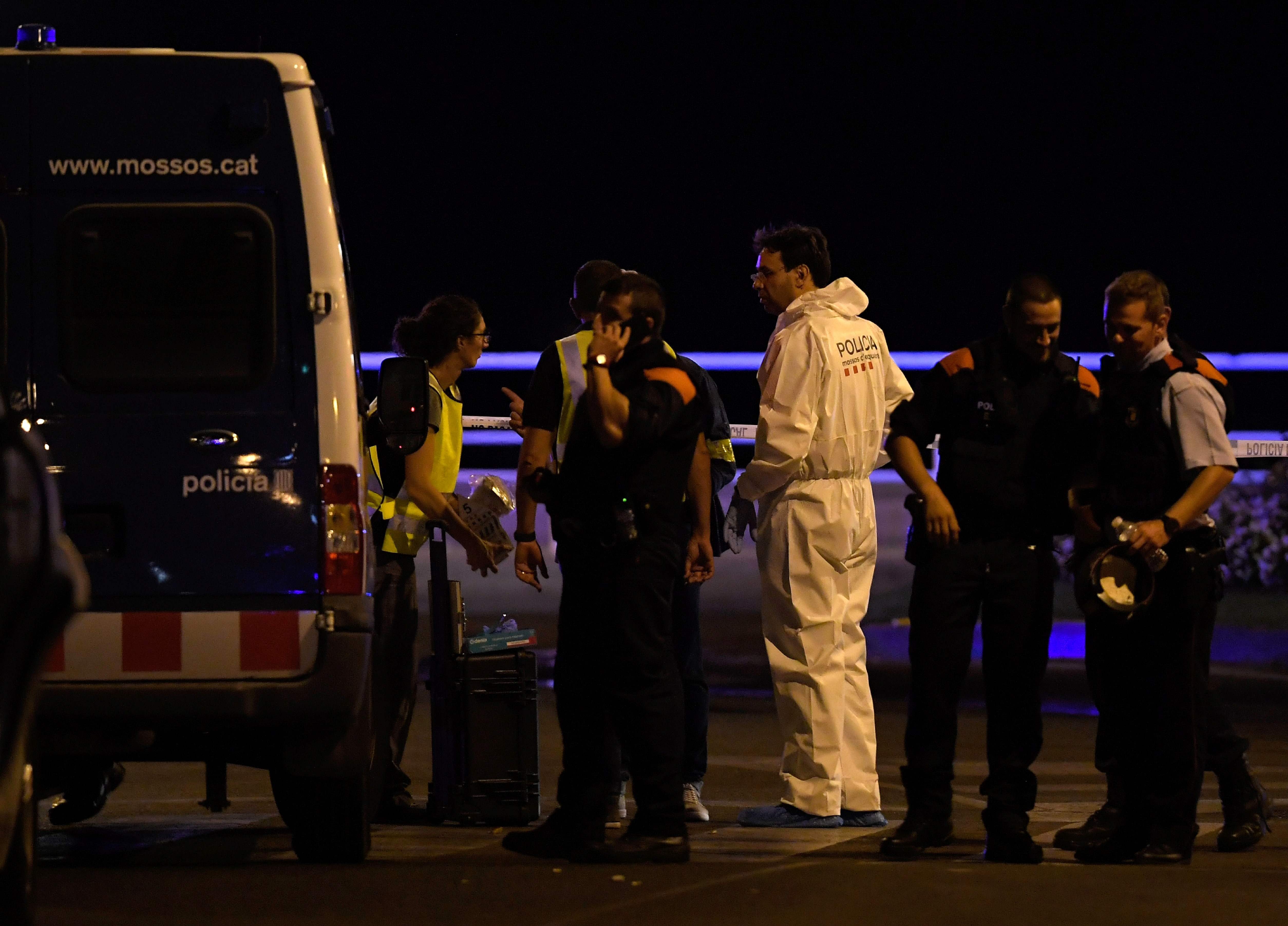 Policemen check the area after police killed five attackers in Cambrils near Tarragona. Photo: AFP