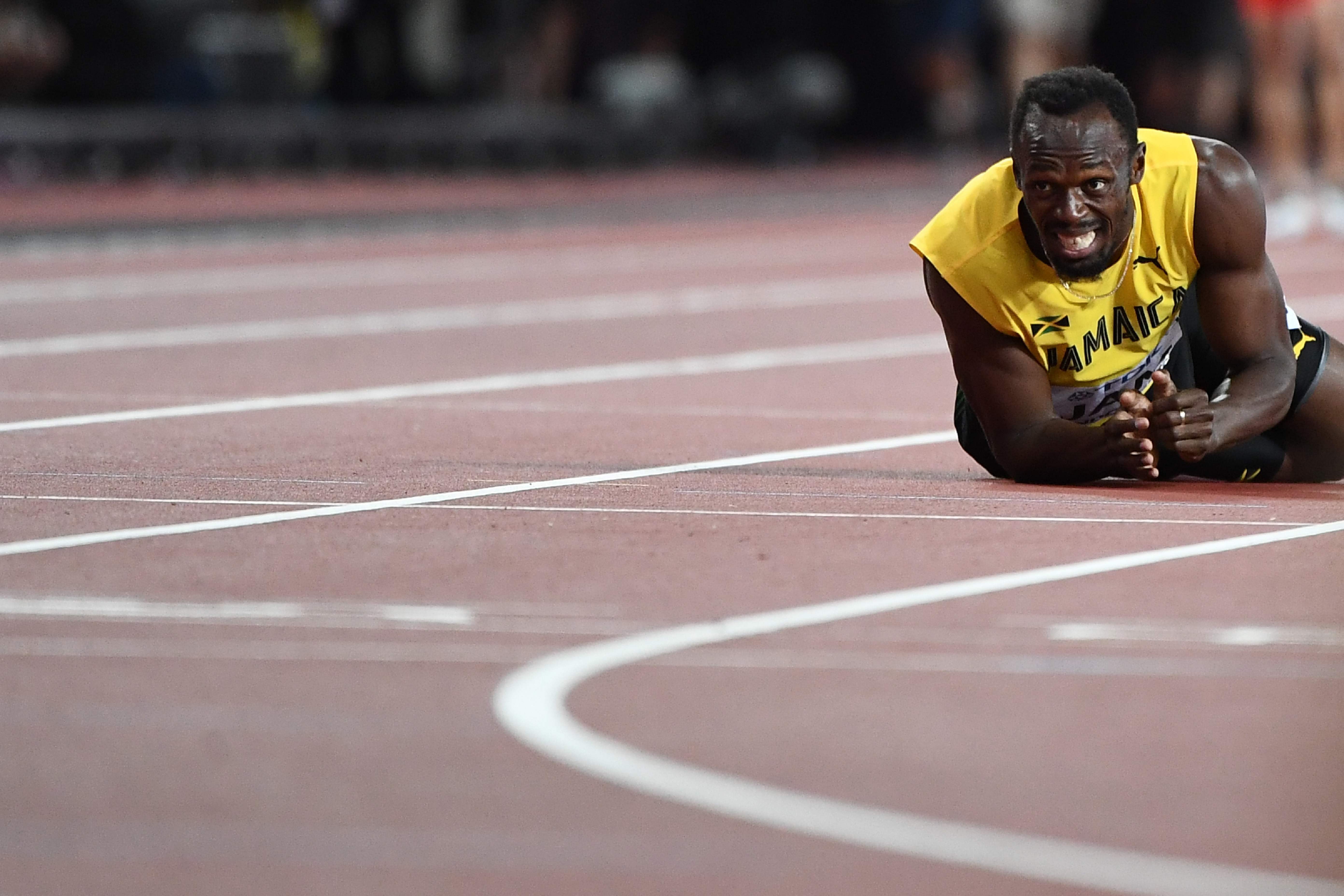 Usain Bolt went down in the 4x100 metres relay final at the world championships. Photo: AFP