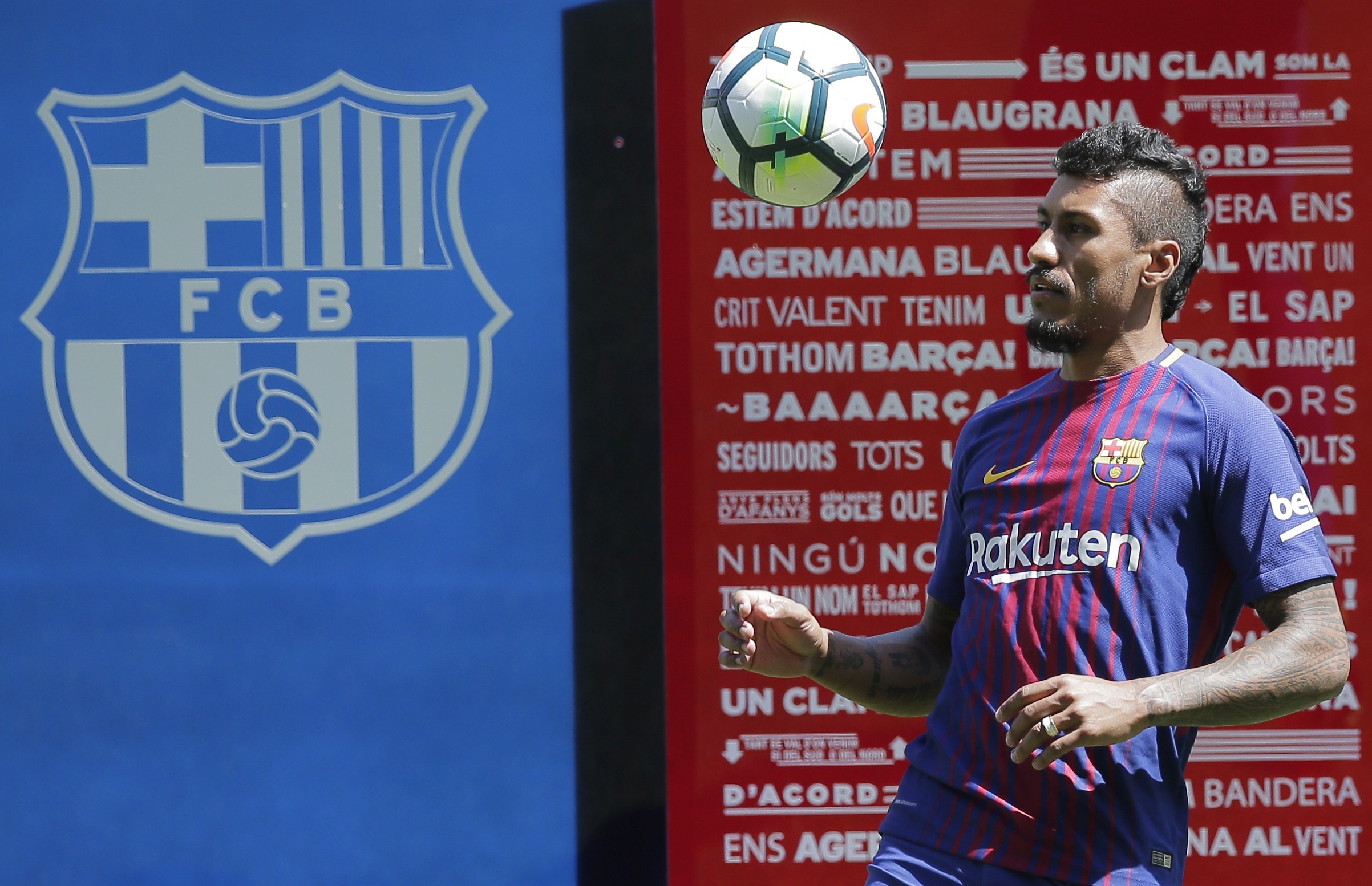 Barcelona’s new signing Paulinho controls a ball during his official presentation at the Nou Camp. Photo: AP