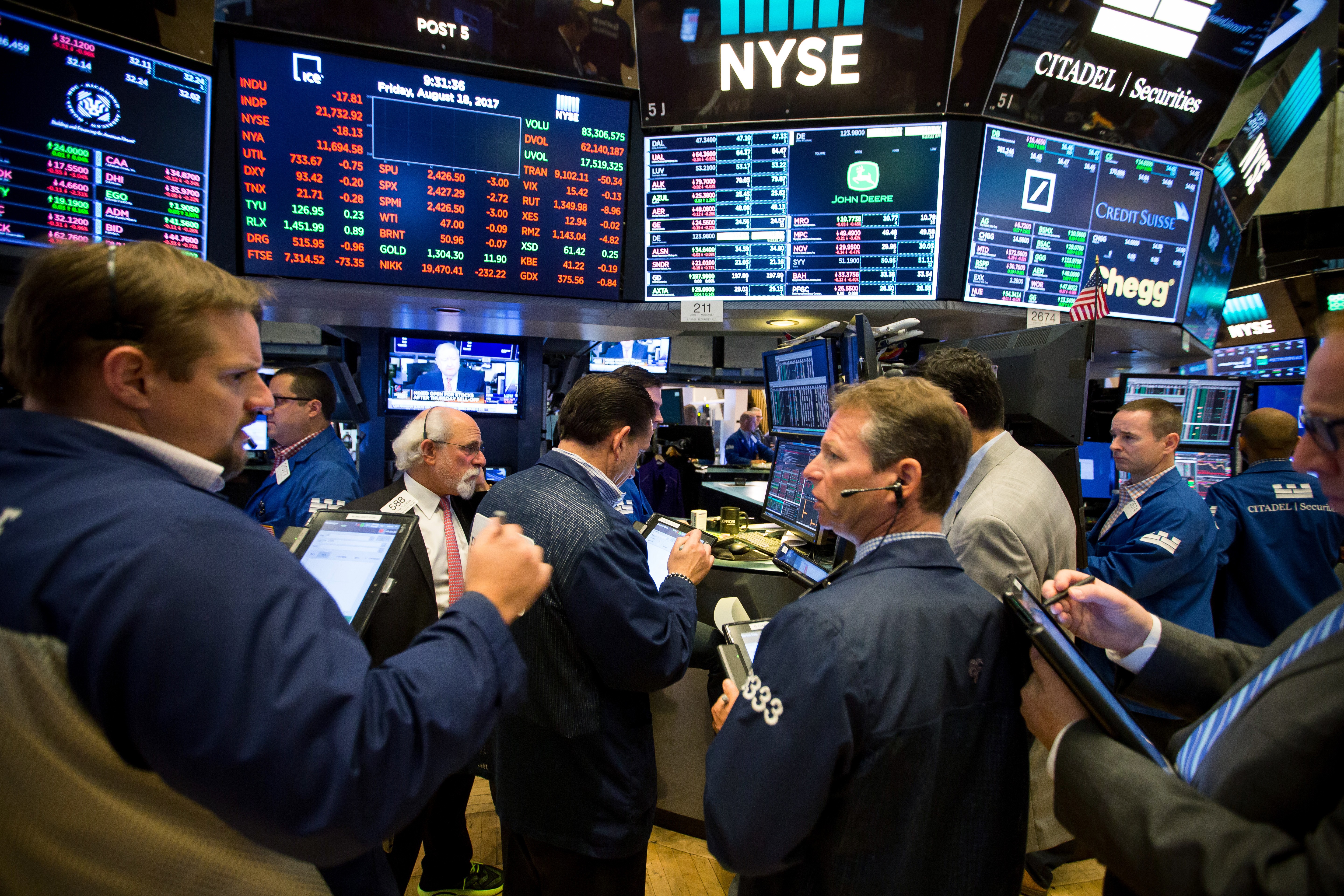 Traders work on the floor of the New York Stock Exchange as share prices weakened because of worries about President Donald Trump’s agenda and the terrorist attacks in Spain. Photo: Bloomberg