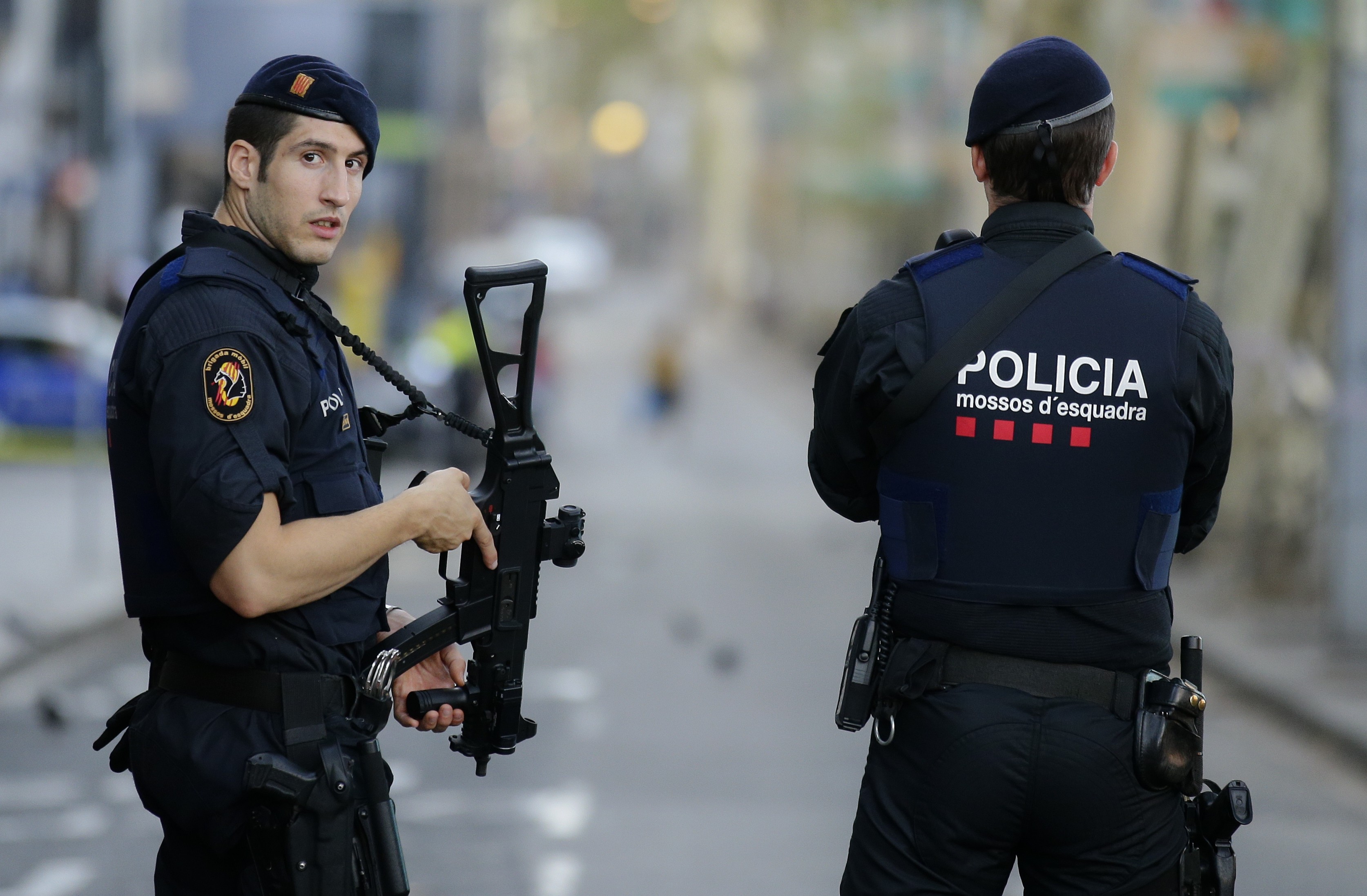Armed police officer stand in Las Ramblas, Barcelona, Spain. Photo: AP