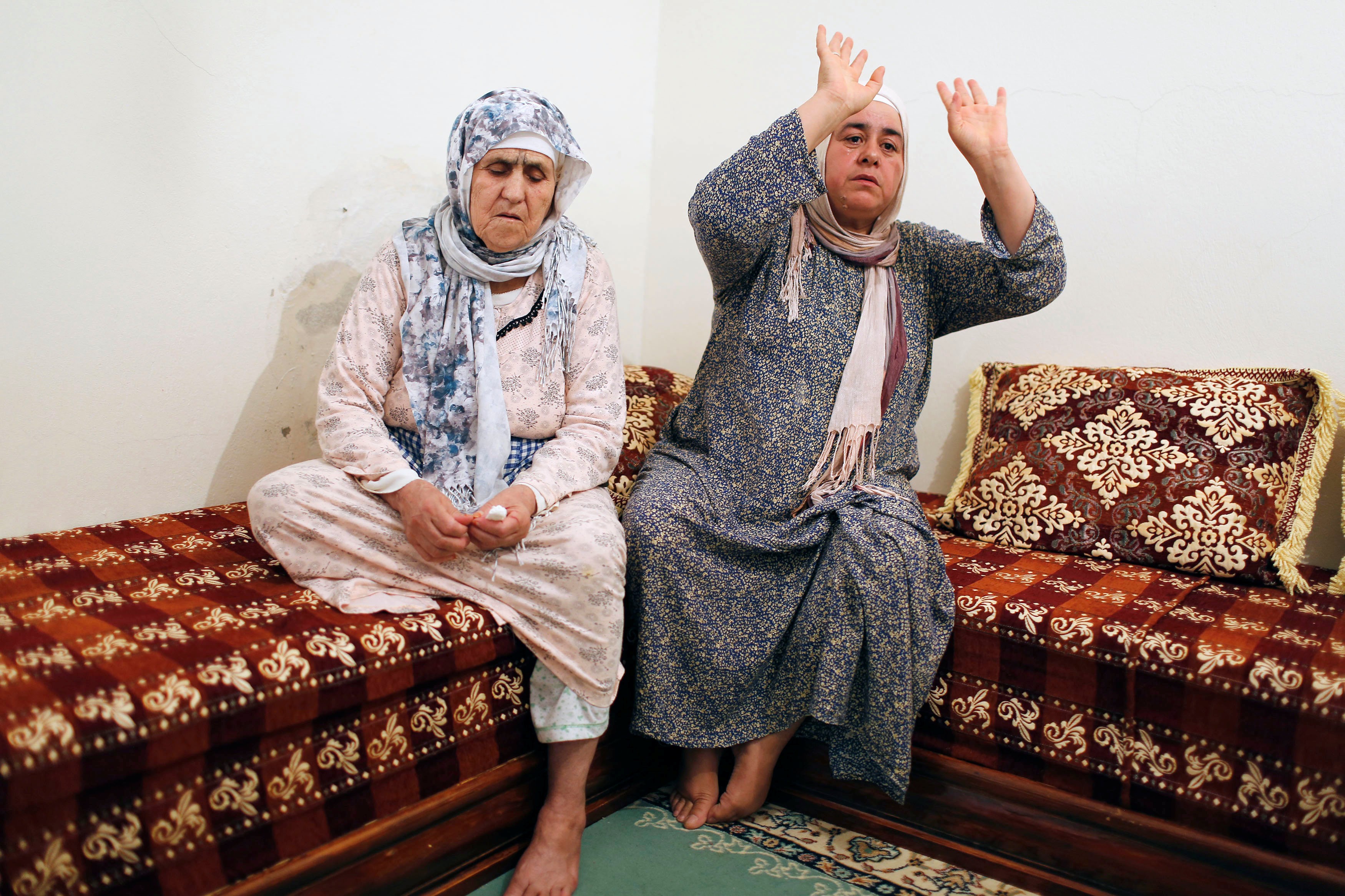 Chrifa Hychami (left), grandmother of Spain terror suspects Mohammed and Omar Hychami - both of whom were shot dead by police - sits with Fatima Abouyaaqoub, aunt of suspects Younes and Houssaine Abouyaaqoub, in their family home in Mrirt, Morocco, on Sunday. Houssaine Abouyaaqoub was also shot dead, while Younes Abouyaaqoub is the subject of a massive manhunt. Photo: Reuters
