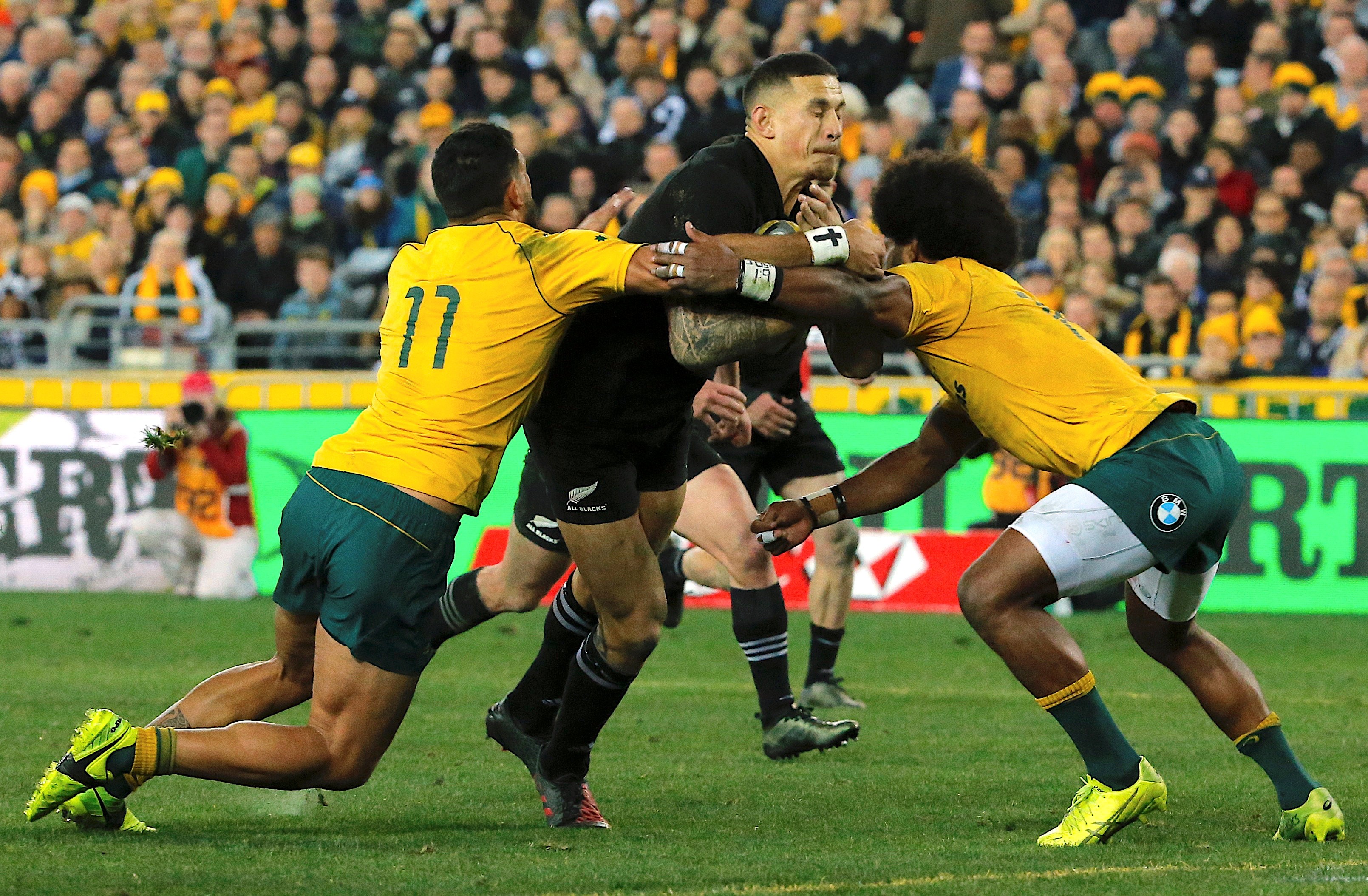 New Zealand’s Sonny Bill Williams is tackled by Australia’s Curtis Rona and Henry Speight. Photo: Reuters