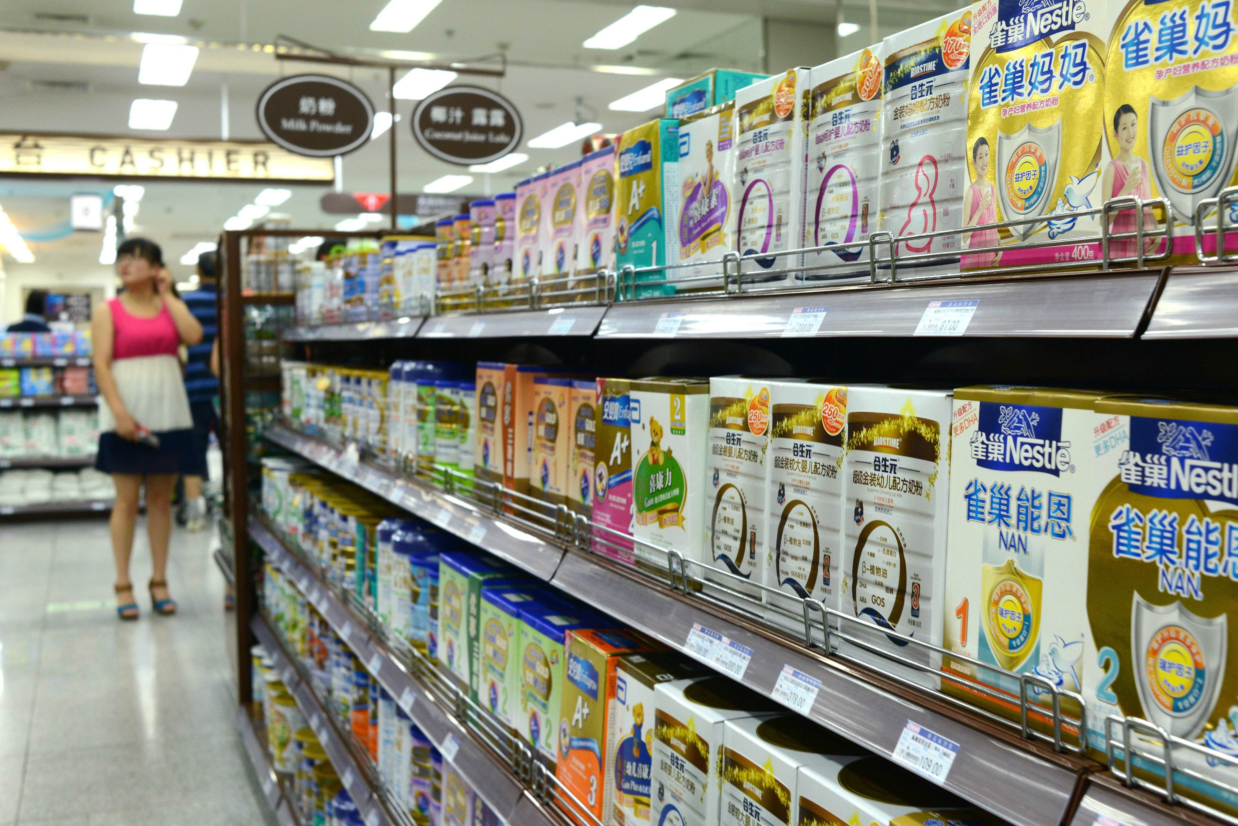 Shelves of milk powder at a supermarket in Beijing in July 2013, amid an investigation into alleged price-fixing by foreign firms in the infant formula sector. Photo: AFP