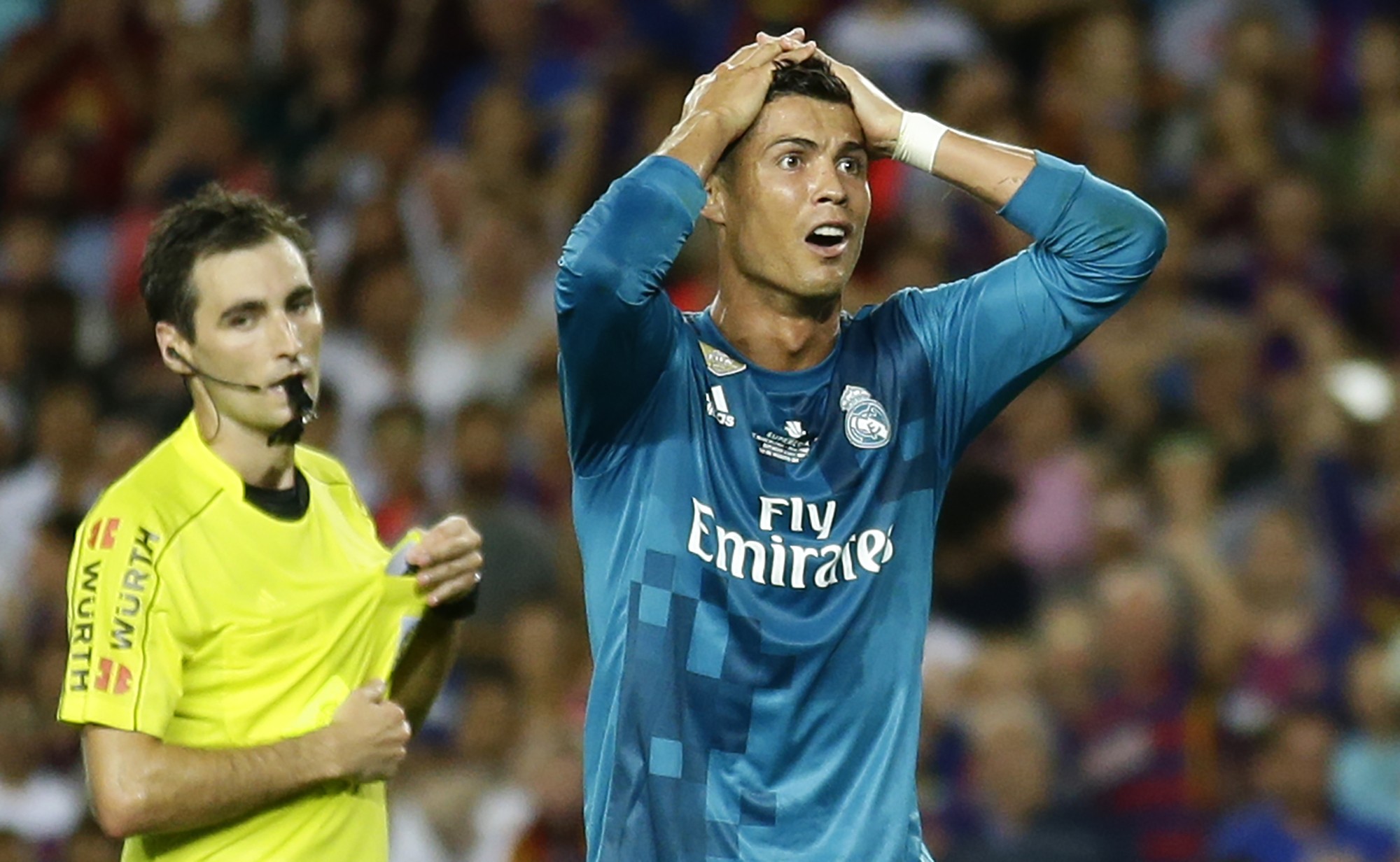 Real Madrid's Cristiano Ronaldo reacts after referee Ricardo de Burgos shows a second yellow card during the Spanish Supercup. Photos: AP