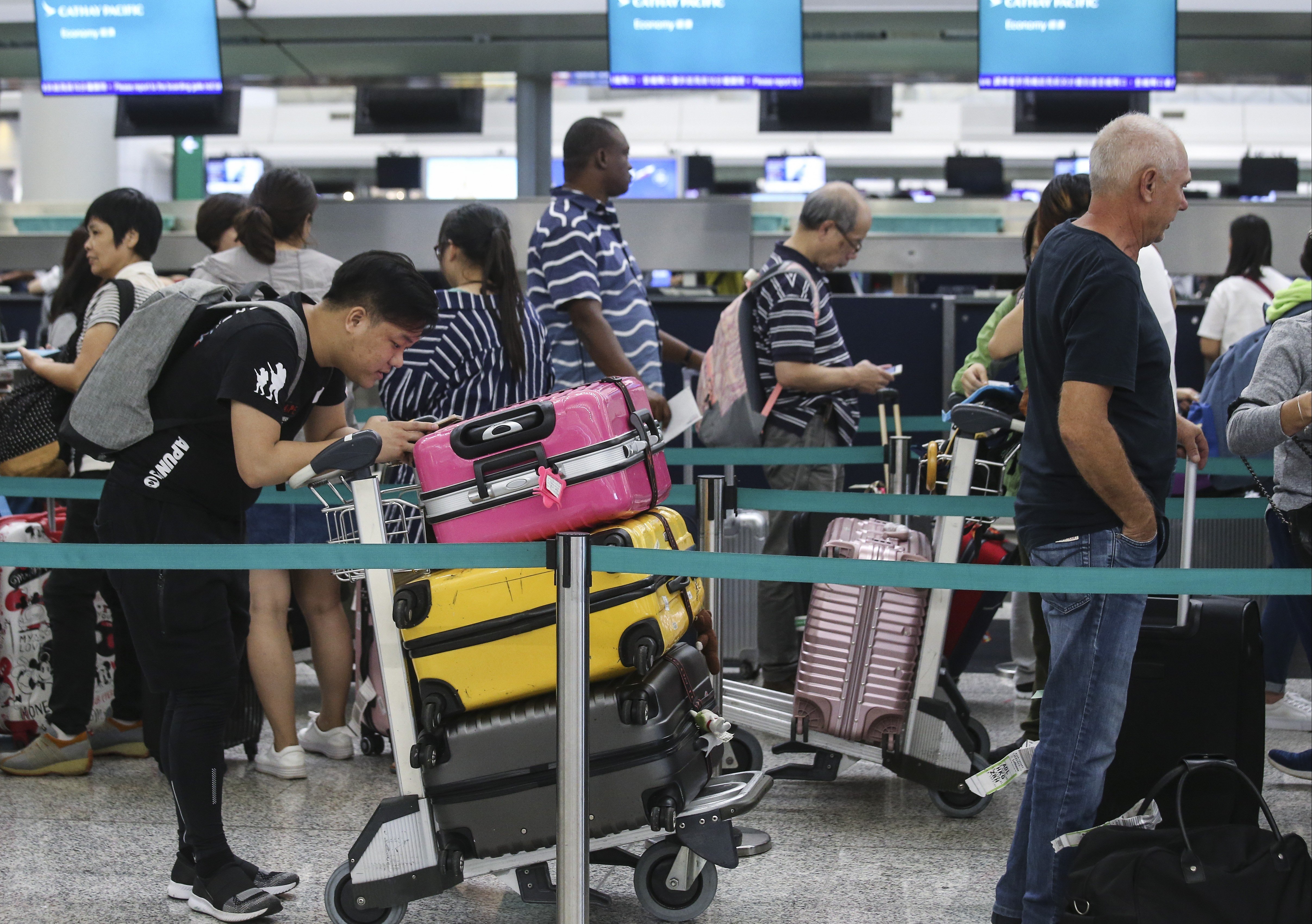 The typhoon caused long delays at the airport. Photo: K. Y. Cheng