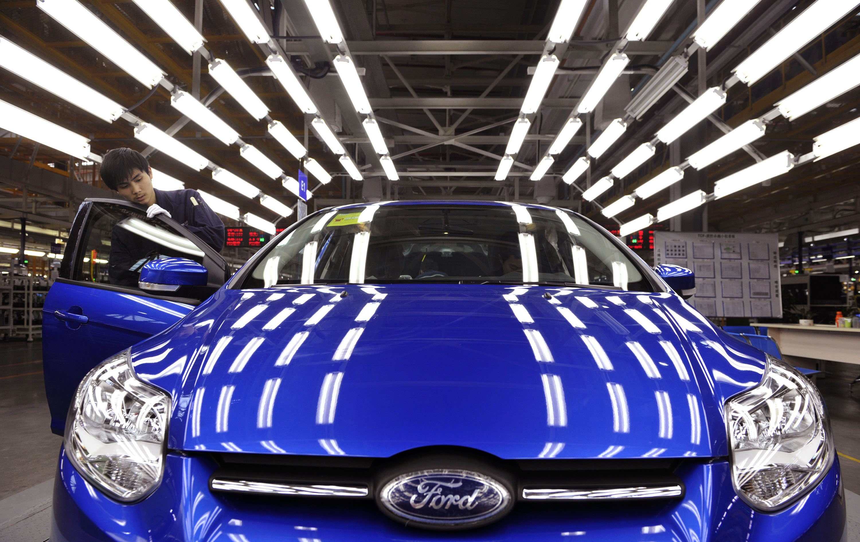 An employee at a Ford assembly line in Chongqing. Photo: Reuters