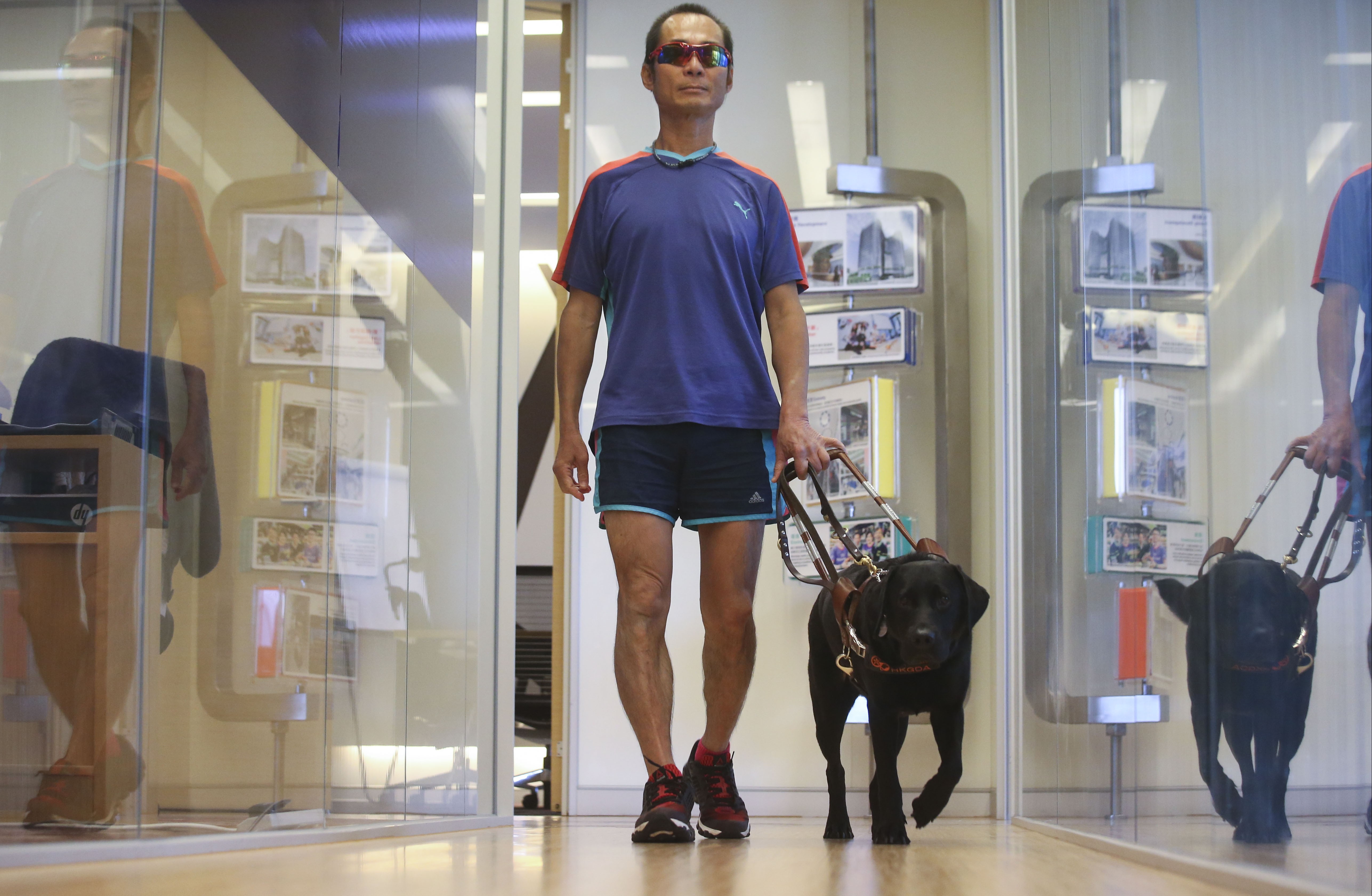Blind athlete Gary Leung says owning a guide dog has greatly improved his standard of living. Photo: K. Y. Cheng