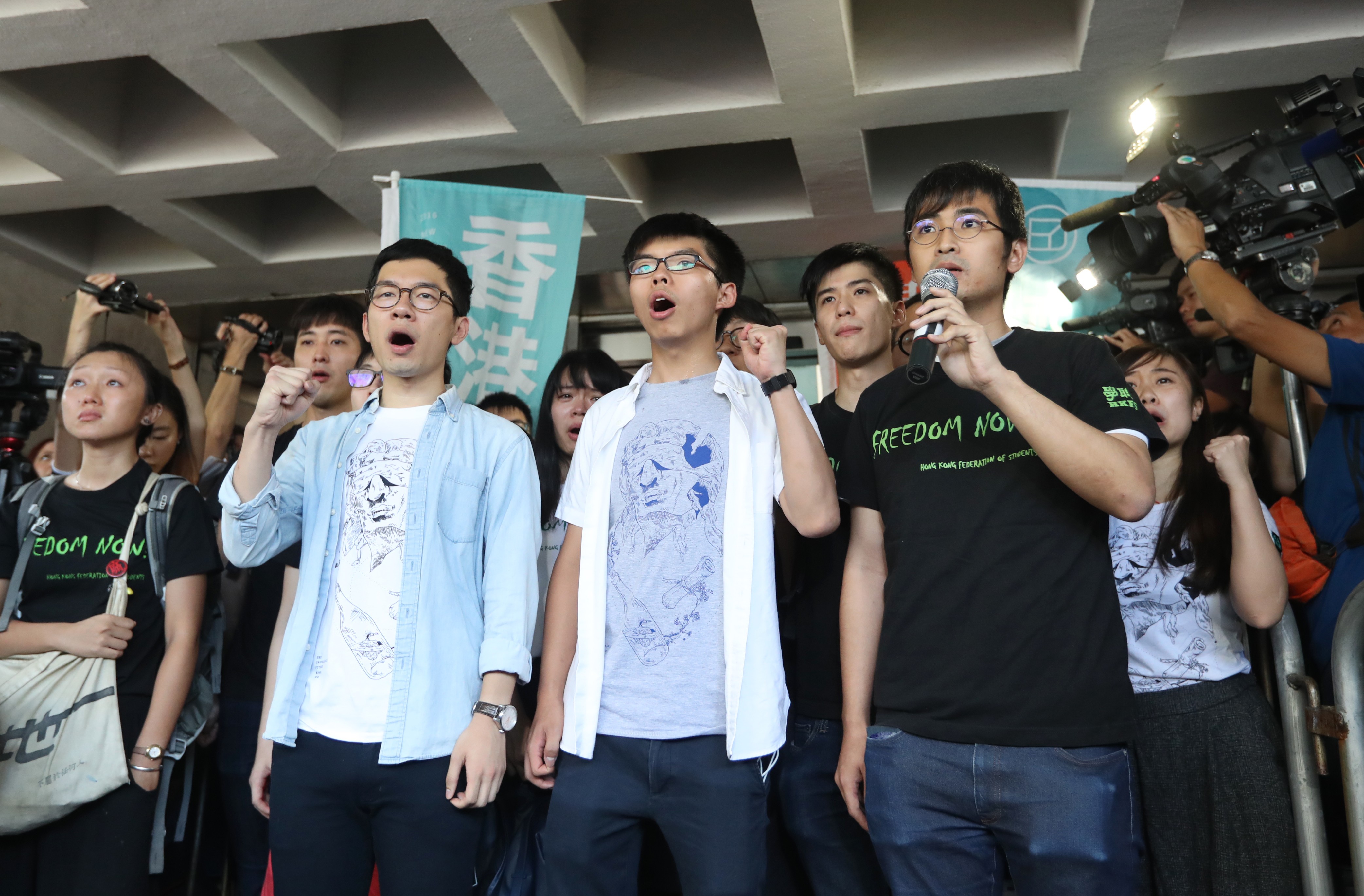 Pro-democracy activists (from left) Nathan Law, Joshua Wong and Alex Chow ahead of their sentencing, at the High Court on August 17. Photo: Edward Wong