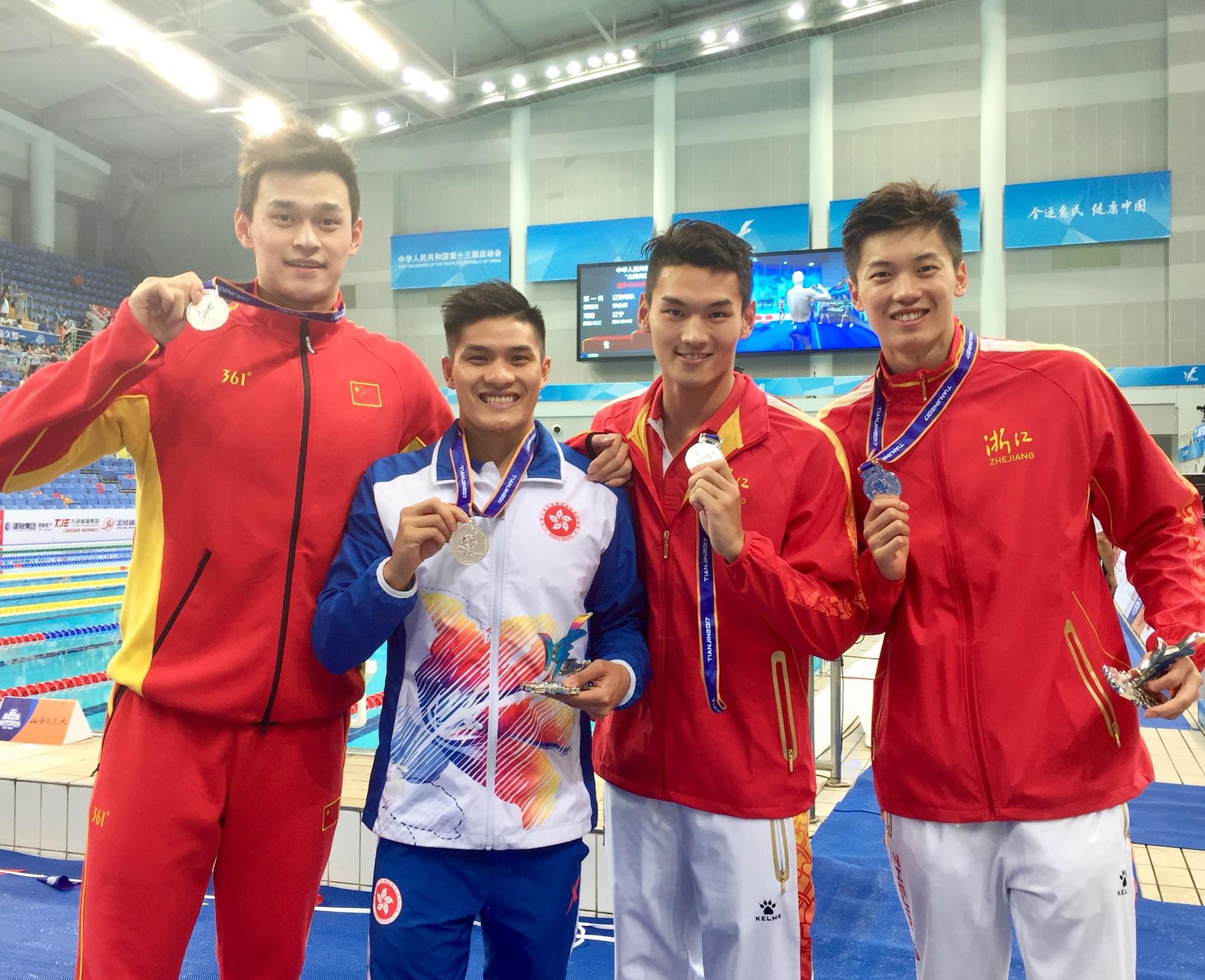 Kenneth To King-him with Sun Yang (left) and the other Zhejiang swimmers, Wang Shun and Xu Jiayu. Photo: Facebook / Kenneth To