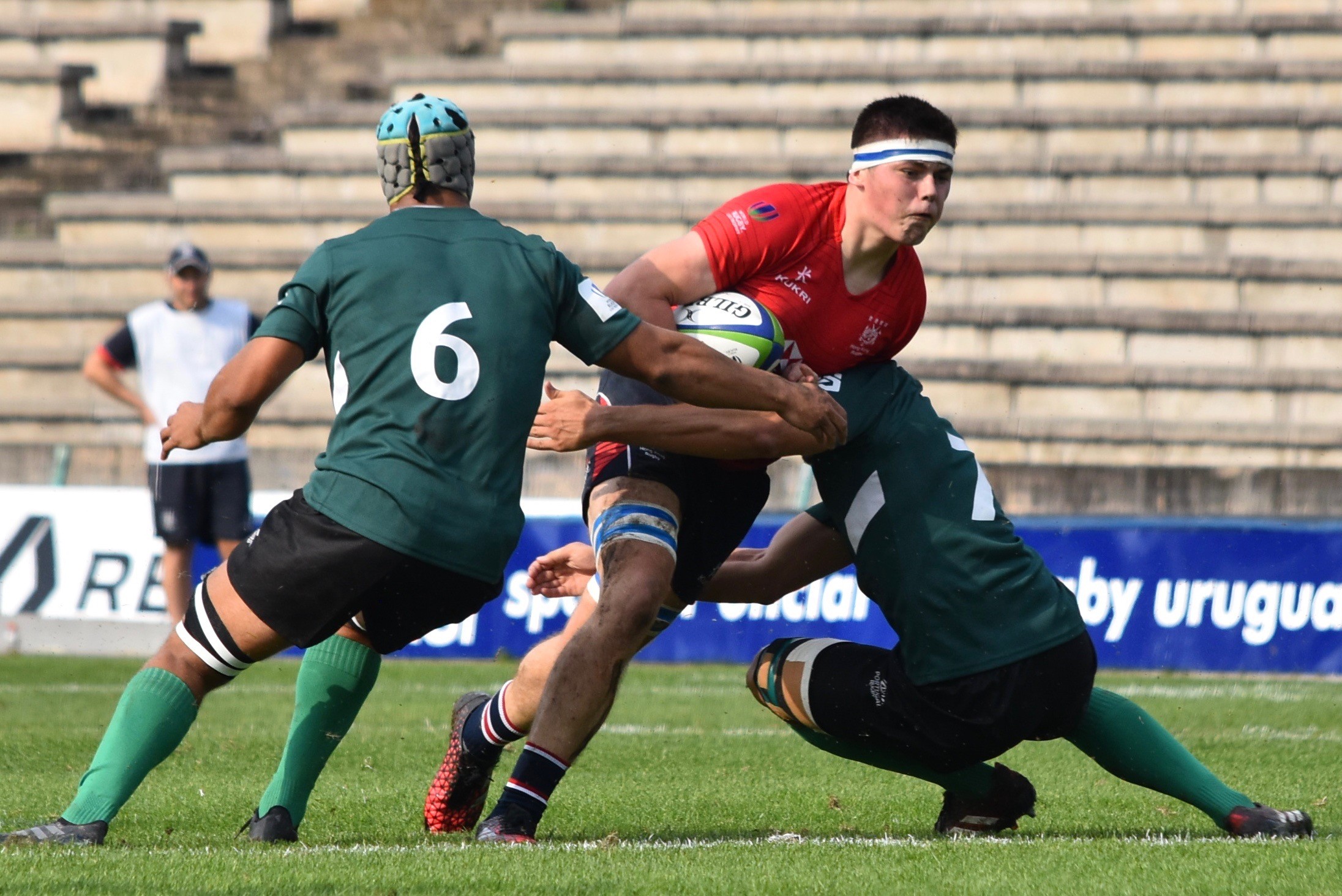 Hong Kong's Jake Barlow is stopped in his tracks against Portugal. Photos: HKRU