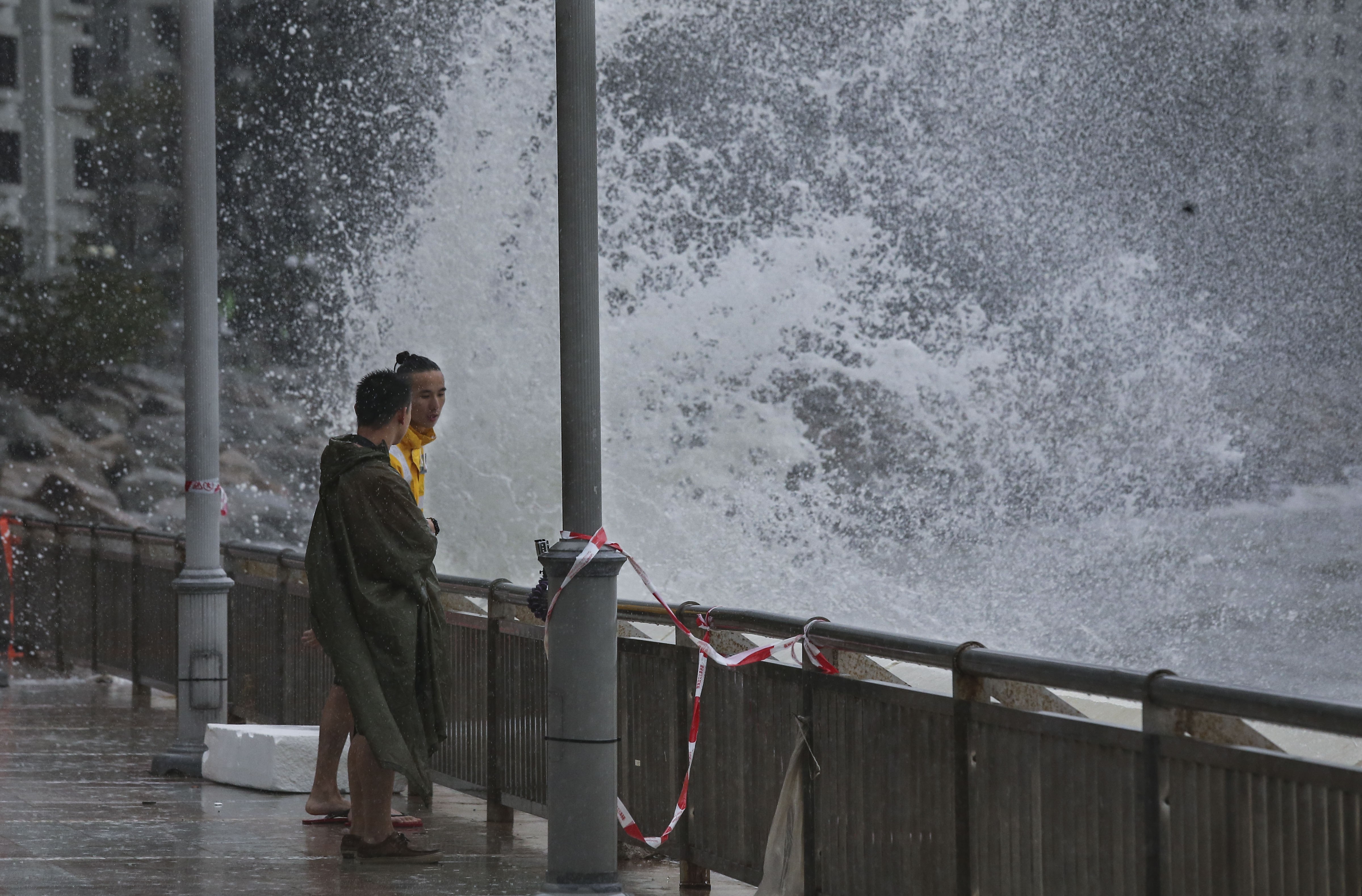 People watch strong waves at Heng Fa Chuen as Typhoon Pakhar hits Hong Kong Photo: Dickson Lee