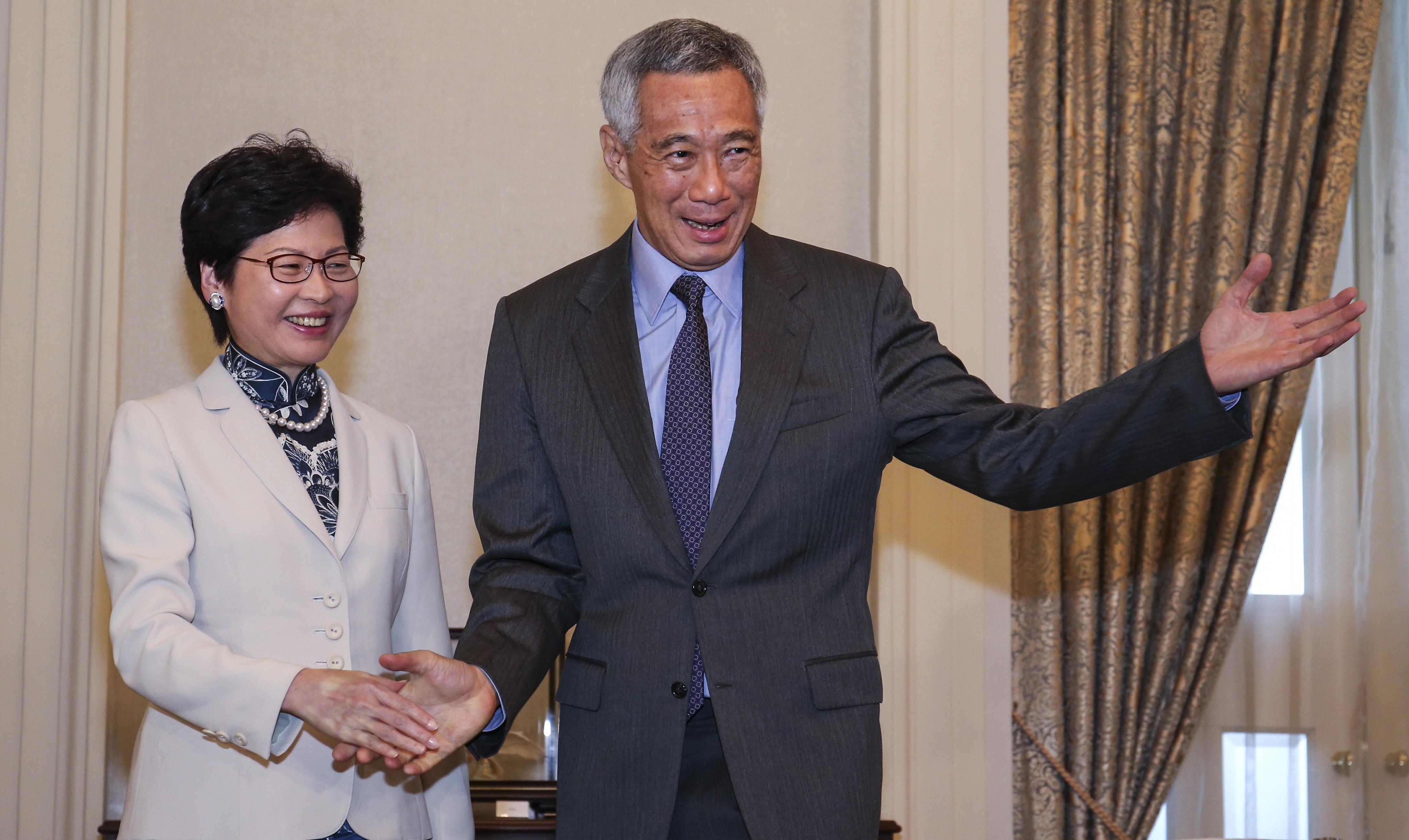 Hong Kong Chief Executive Carrie Lam meets Prime Minister Lee Hsien Loong of Singapore on August 3. Photo: K. Y. Cheng