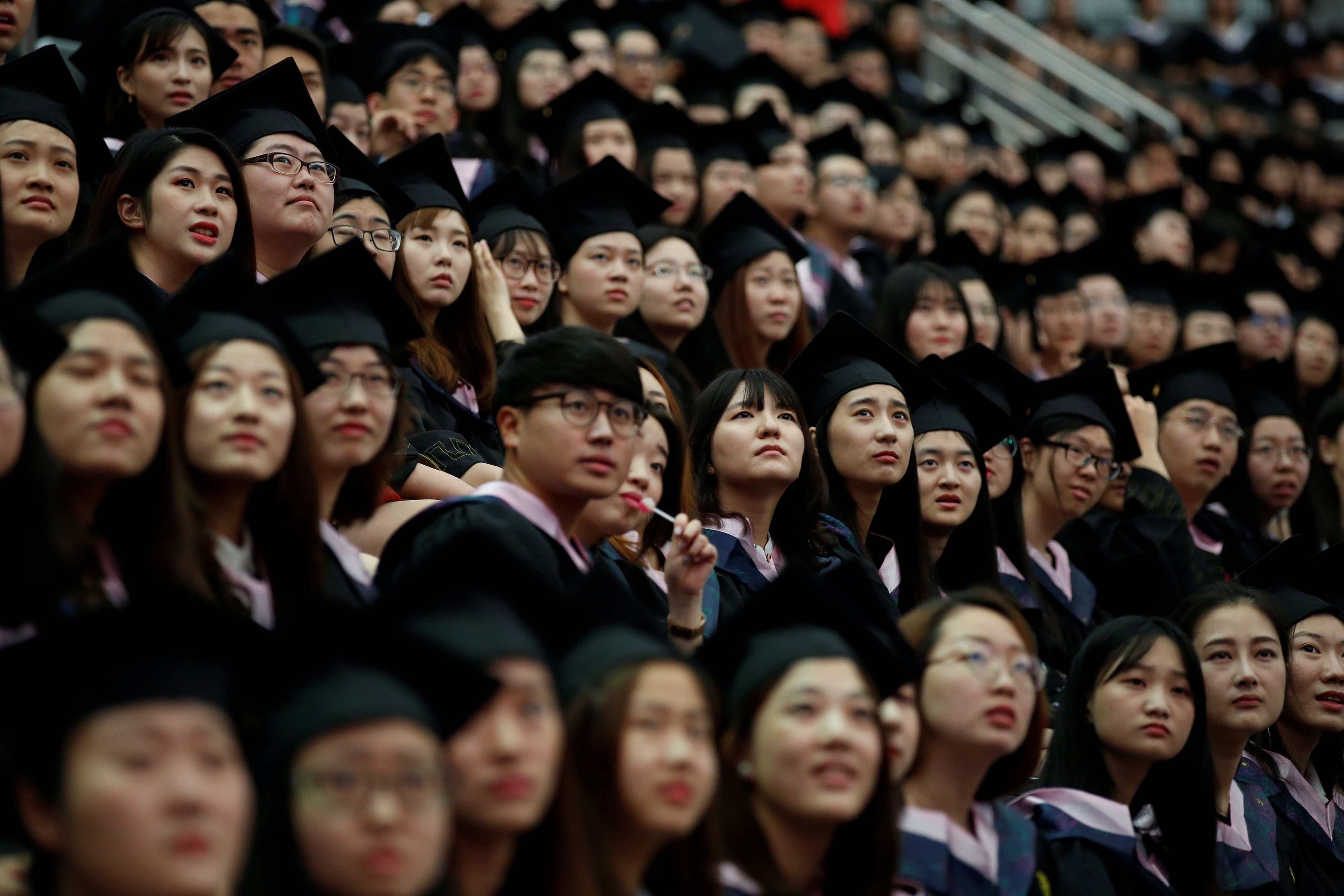 Students attend a graduation ceremony at Fudan University in Shanghai, in June. Photo: Reuters