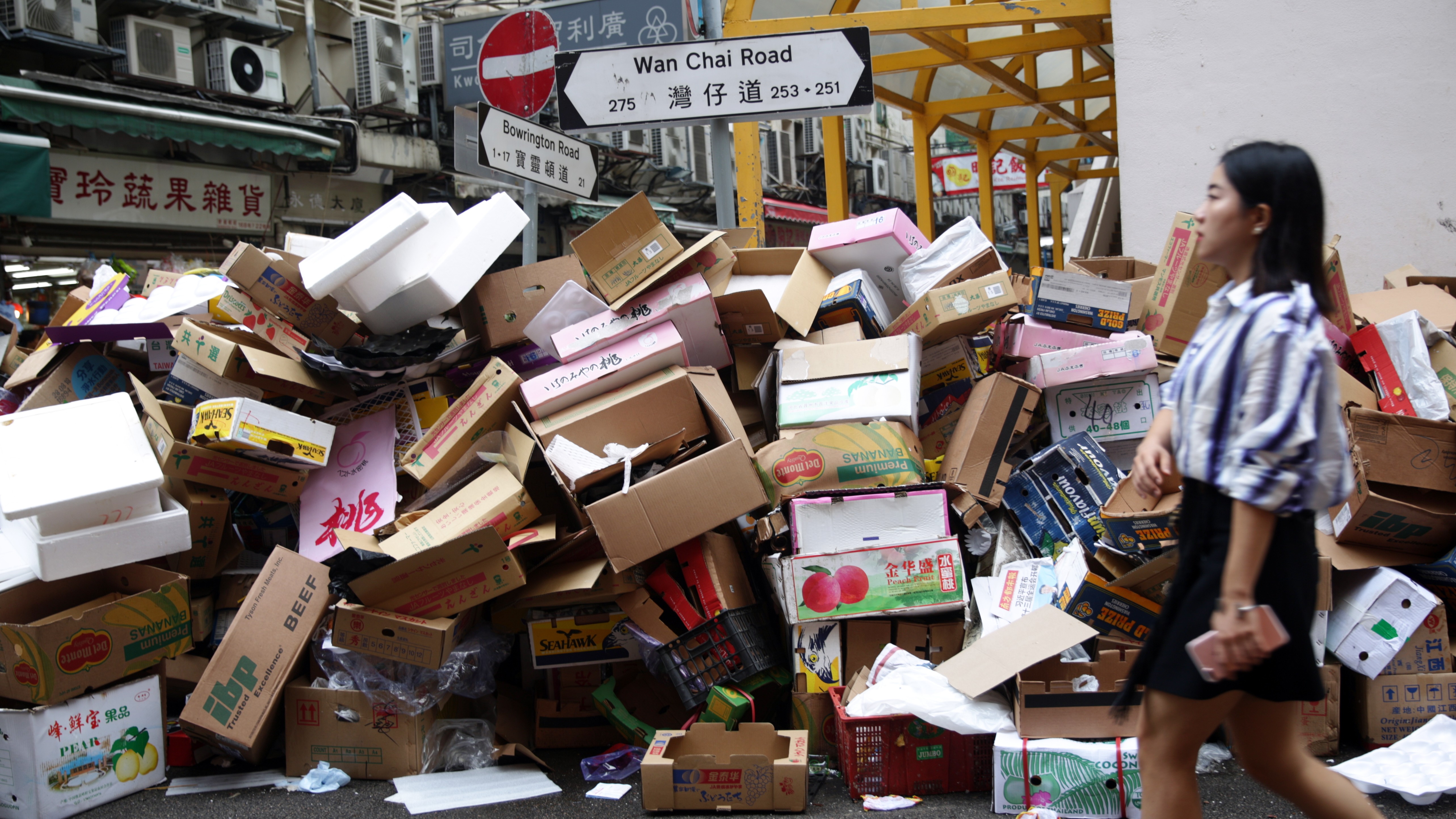Waste boxes piled at a street corner in Wan Chai on Wednesday. Photo: Sam Tsang