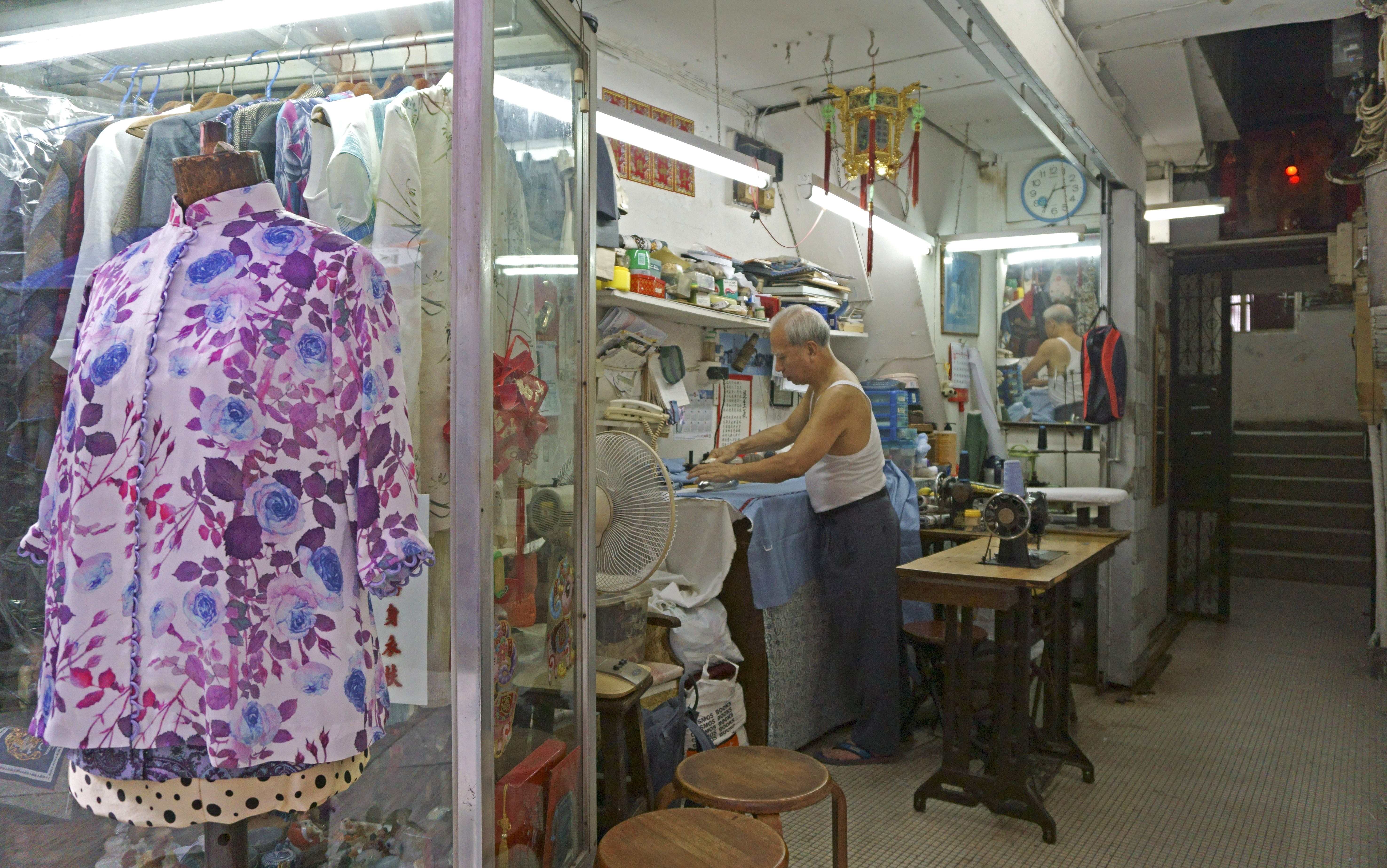 In the second of a series of portraits of the people still working in tiny spaces under the city’s staircases, we meet a cheongsam maker carving out a humble living surrounded by the swanky restaurants and bars of SoHo