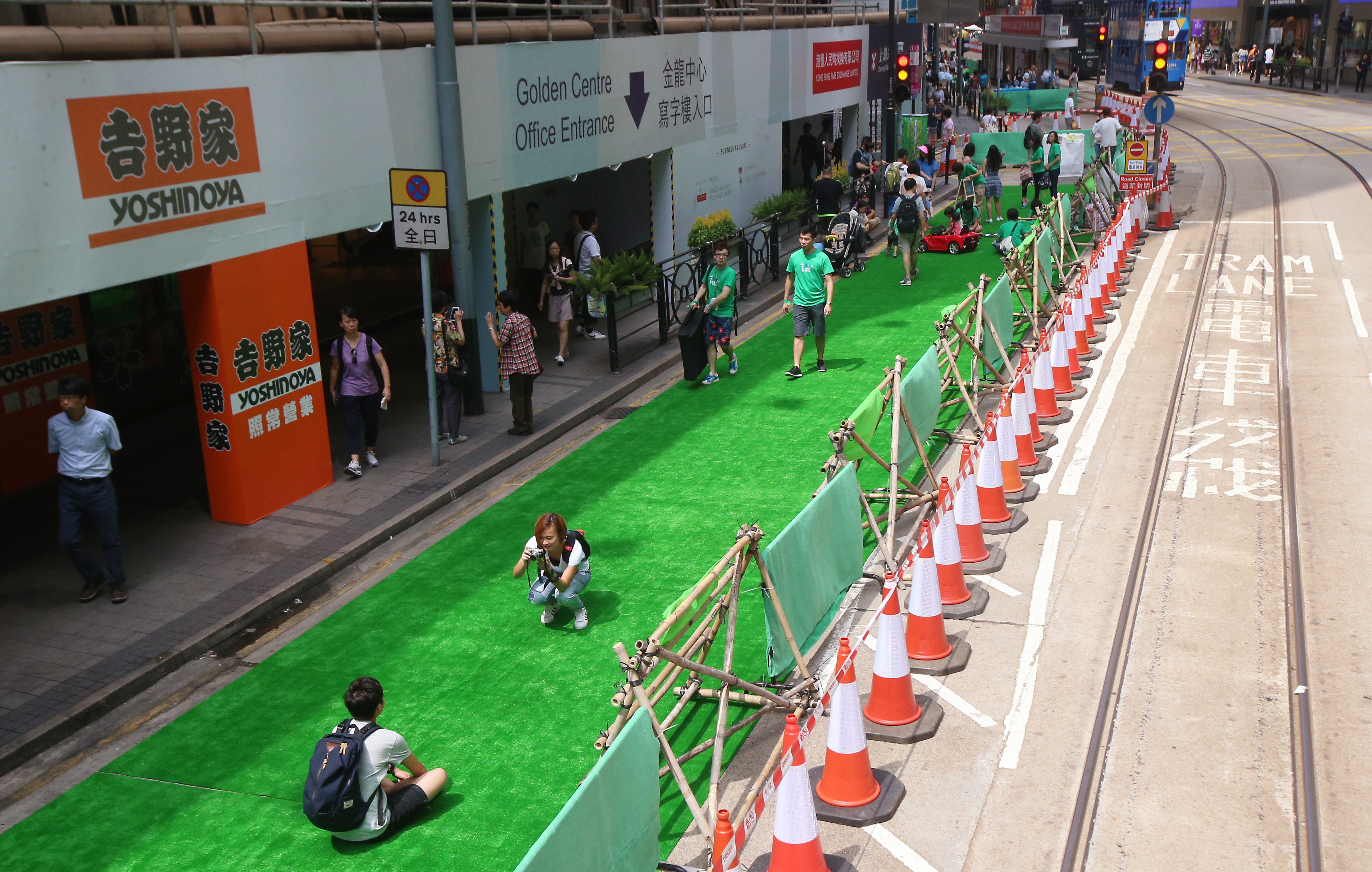 Visitors enjoy public space on Des Veoux Road Central during a trial initiative to pedestrianise the arterial road in Hong Kong’s business district, last September 25. Photo: David Wong