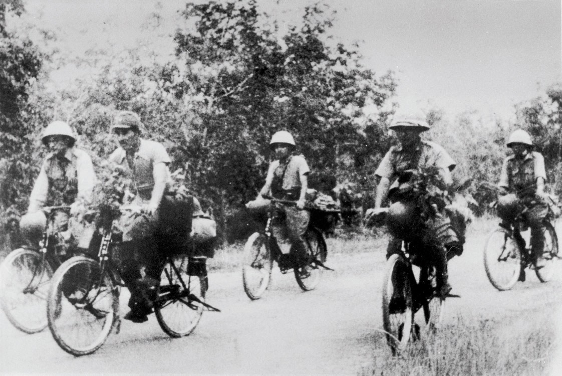 Bike-riding Japanese soldiers in Malaya, during the second world war.