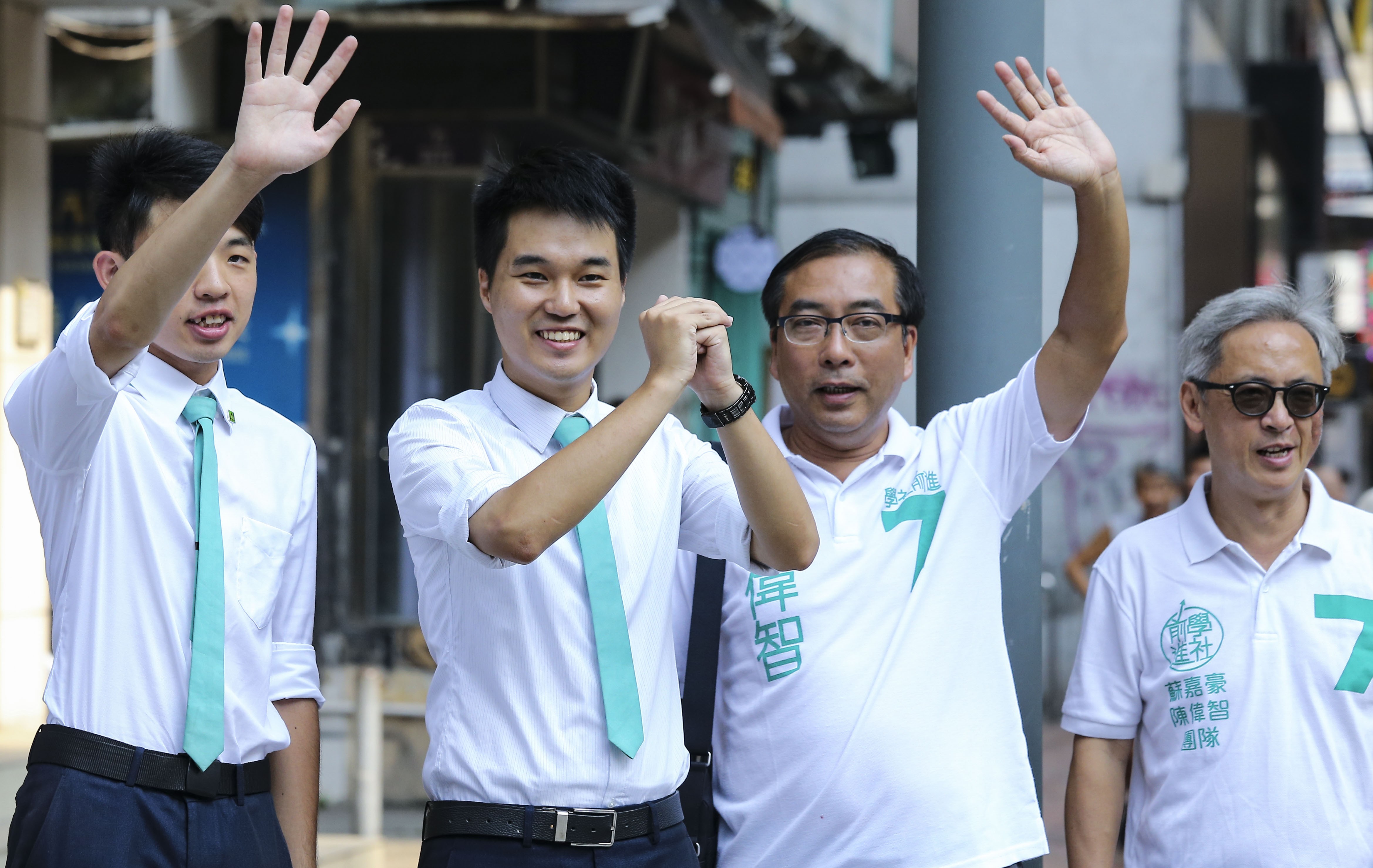 Sulu Sou Ka-hou (second left) celebrates on Monday after winning a seat in the Macau Legislative Assembly election. Photo: Dickson Lee