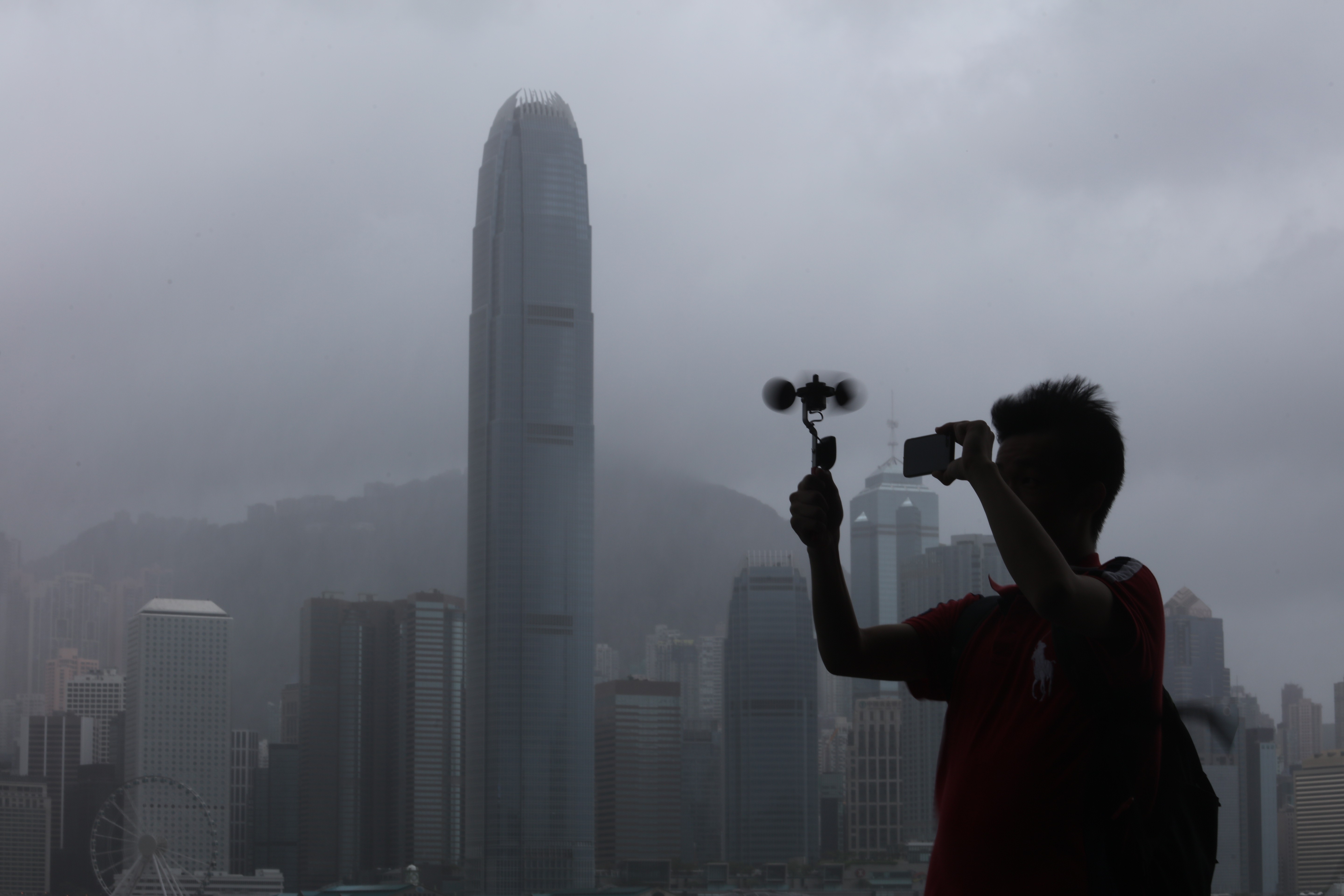 Someone hecking the wind speed at Victoria Harbour in Tsim Sha Tsui as Typhoon Pakhar nears Hong Kong. Photo: Felix Wong