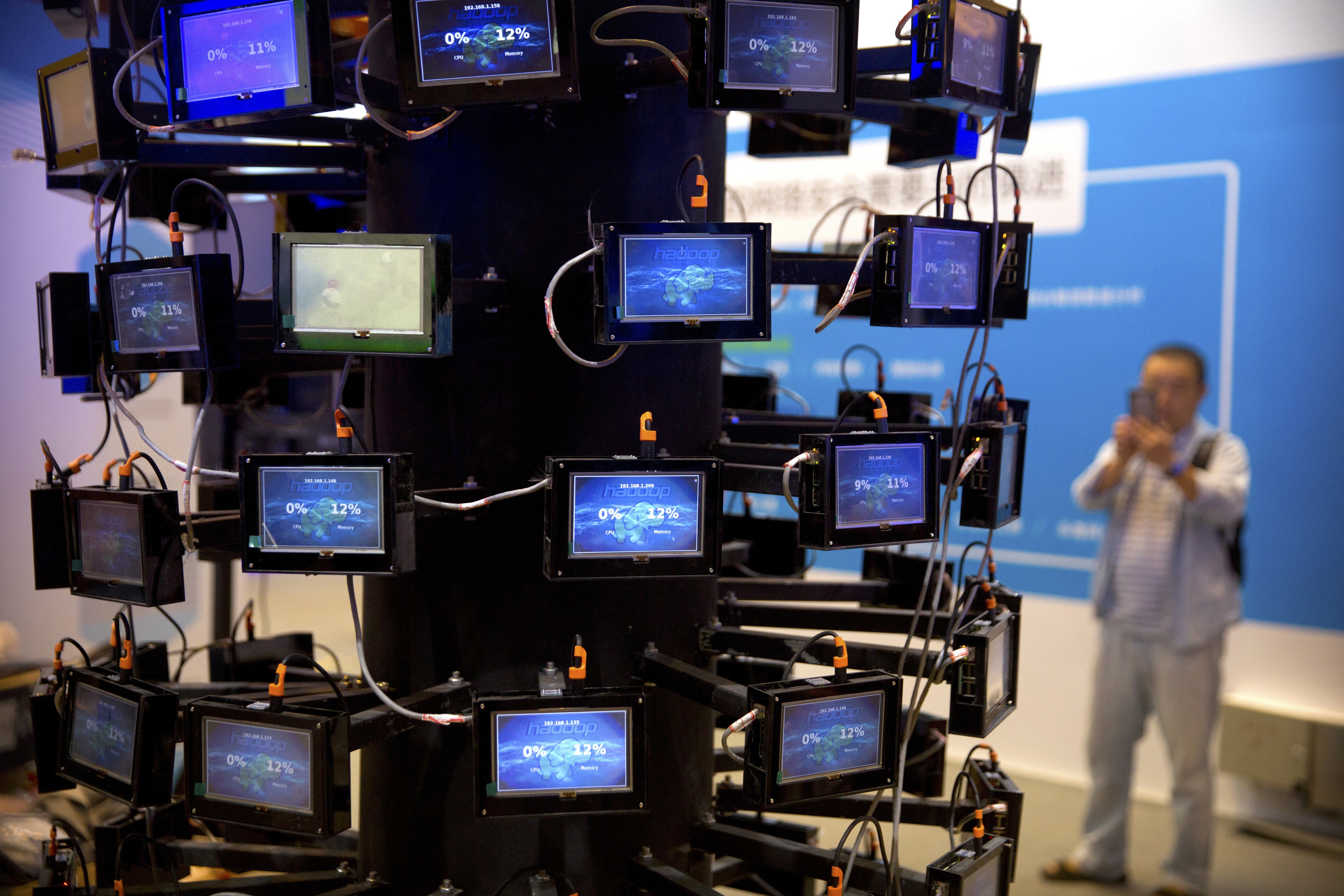 An attendee looks at a digital representation of network connectivity at a vendor's display at the China internet Security Conference in Beijing earlier this month. Photo: AP