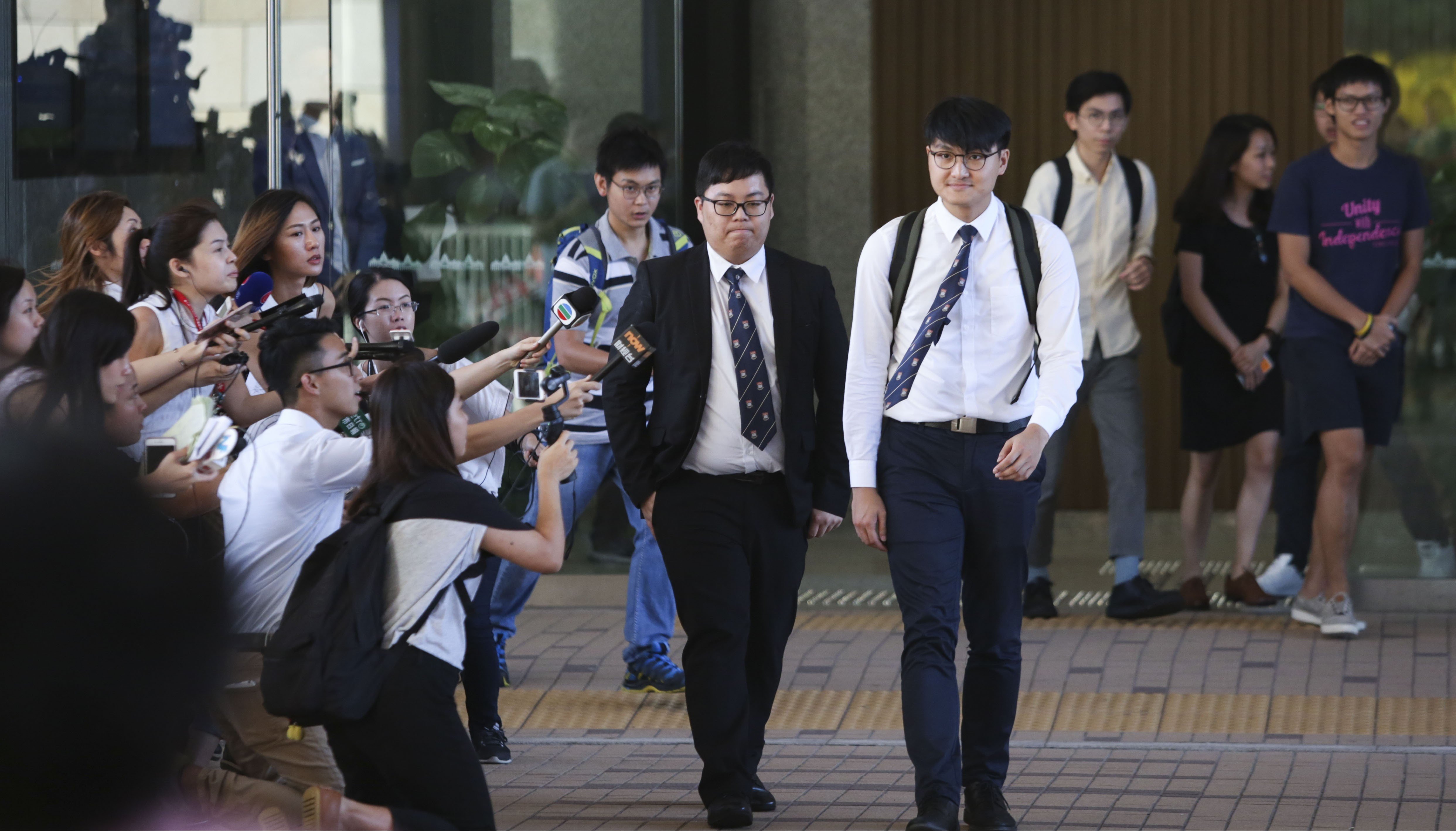 Former student leaders Colman Li Fung-kei (left) and Billy Fung Jing-en (right) sentenced to community service over his role in the chaotic University of Hong Kong siege. Photo: Sam Tsang