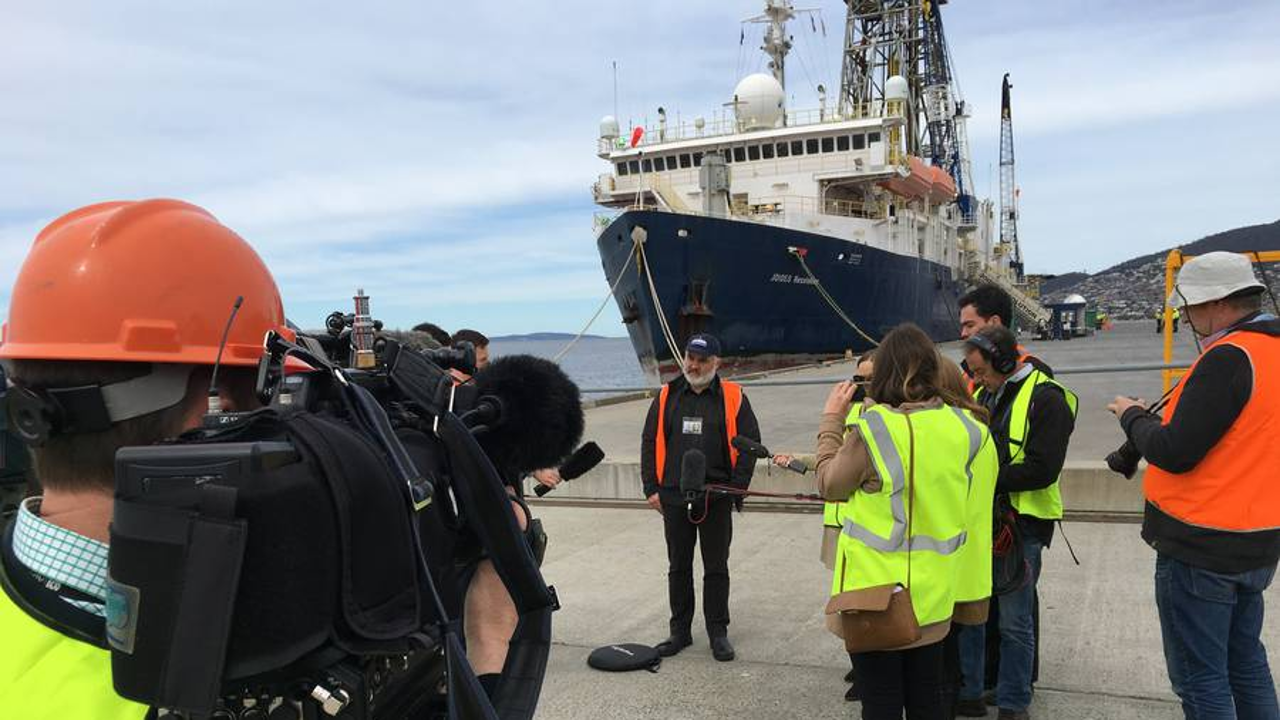 Expedition co-leader Professor Rupert Sutherland speaks with media in front of the JOIDES Resolution research vessel in Hobart, Tasmania. Photo: Supplied