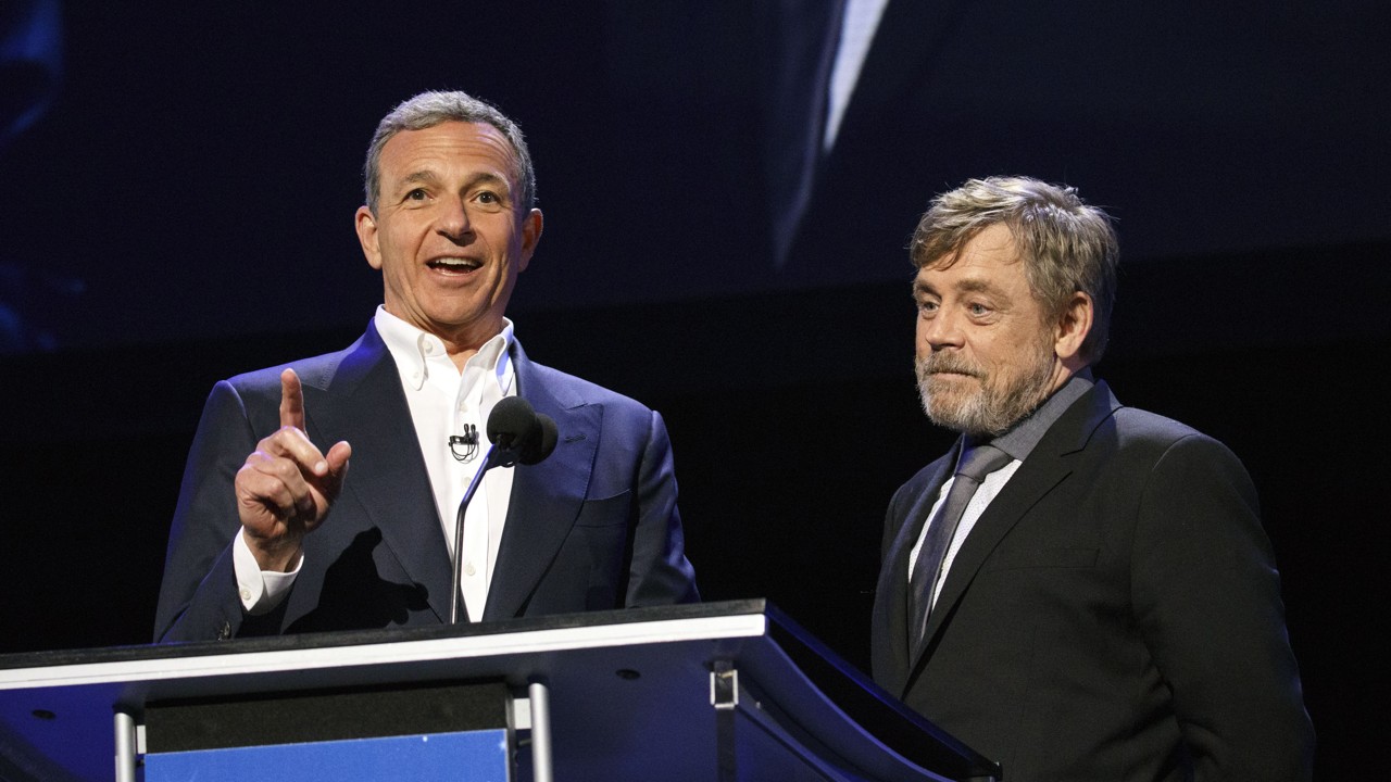 Bob Iger, chairman and chief executive officer of The Walt Disney Co., left, speaks on stage with actor Mark Hamill during the Disney Legends Awards at the D23 Expo 2017 in Anaheim, California, U.S. Photo: Patrick T. Fallon/Bloomberg