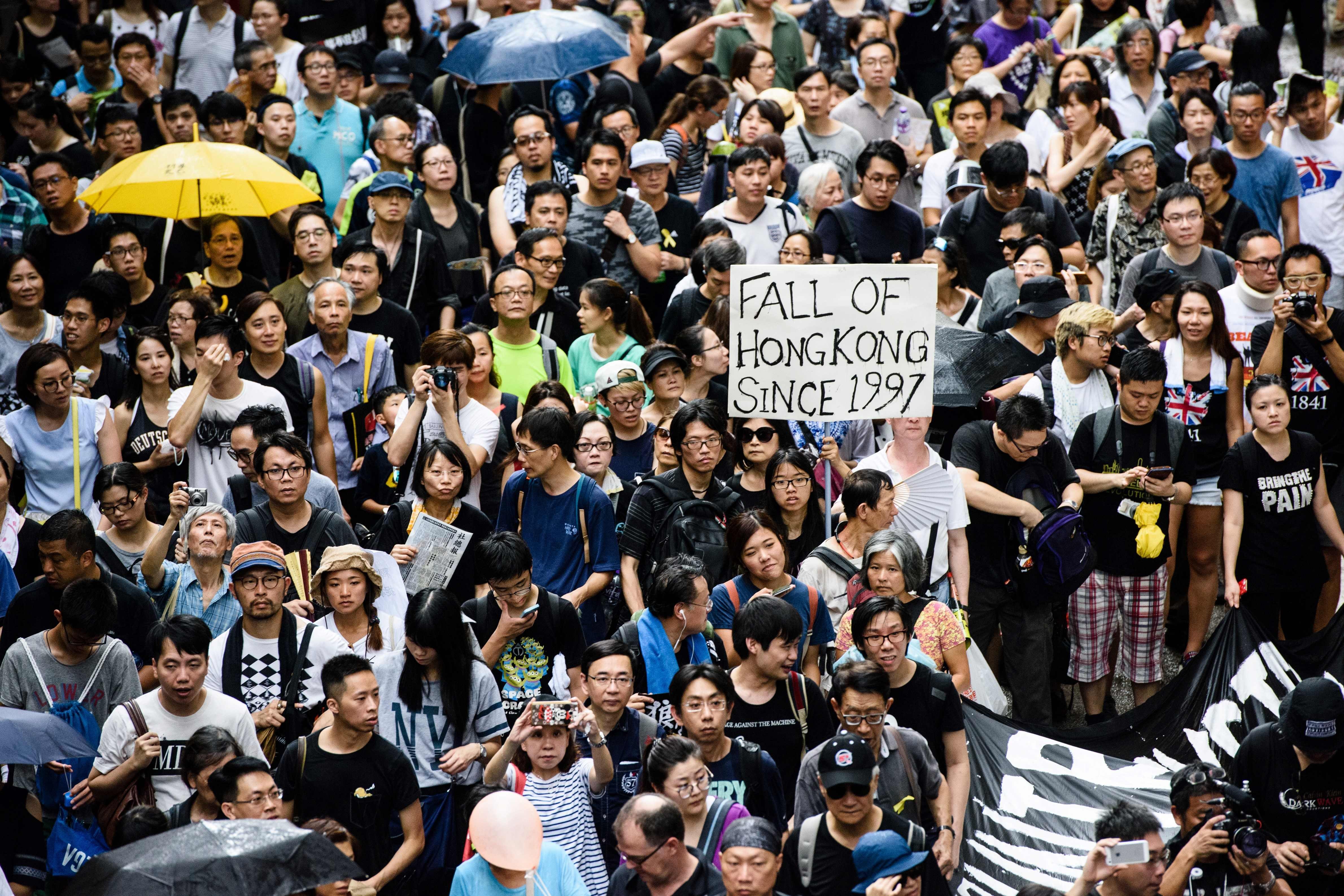 Protesters march in Hong Kong on July 1 this year, the 20th anniversary of the city's handover from British to Chinese rule. Photo: AFP