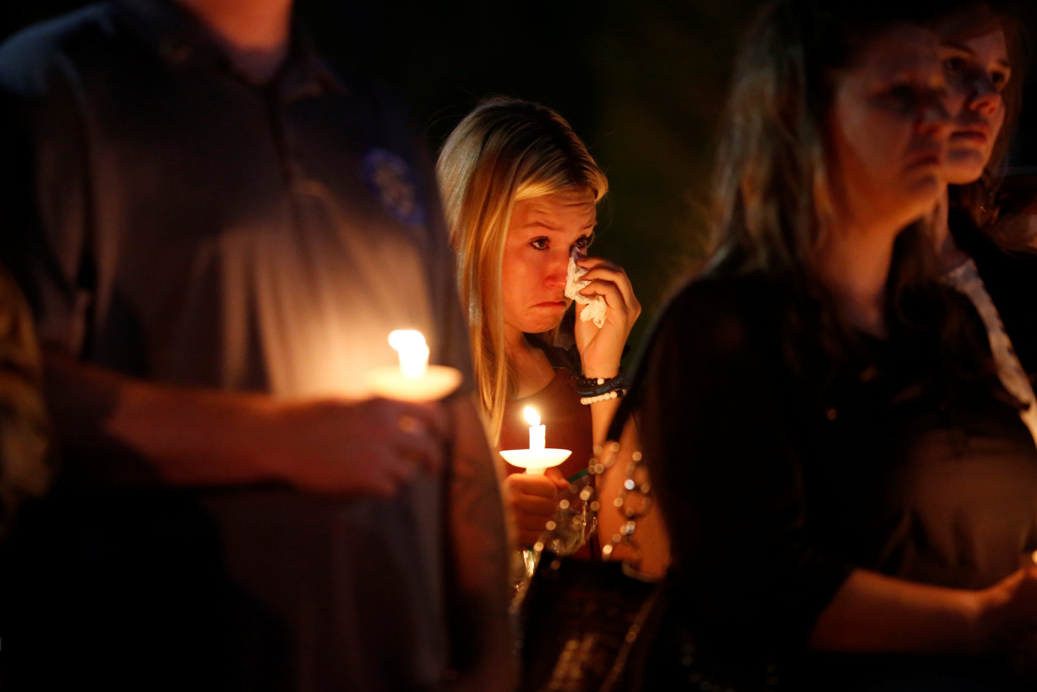 A woman wipes away tears during a memorial service for Charleston Hartfield, an off-duty Las Vegas police officer who was killed during the Route 91 music festival mass shooting in Las Vegas, Nevada, on October 5. Photo: Reuters